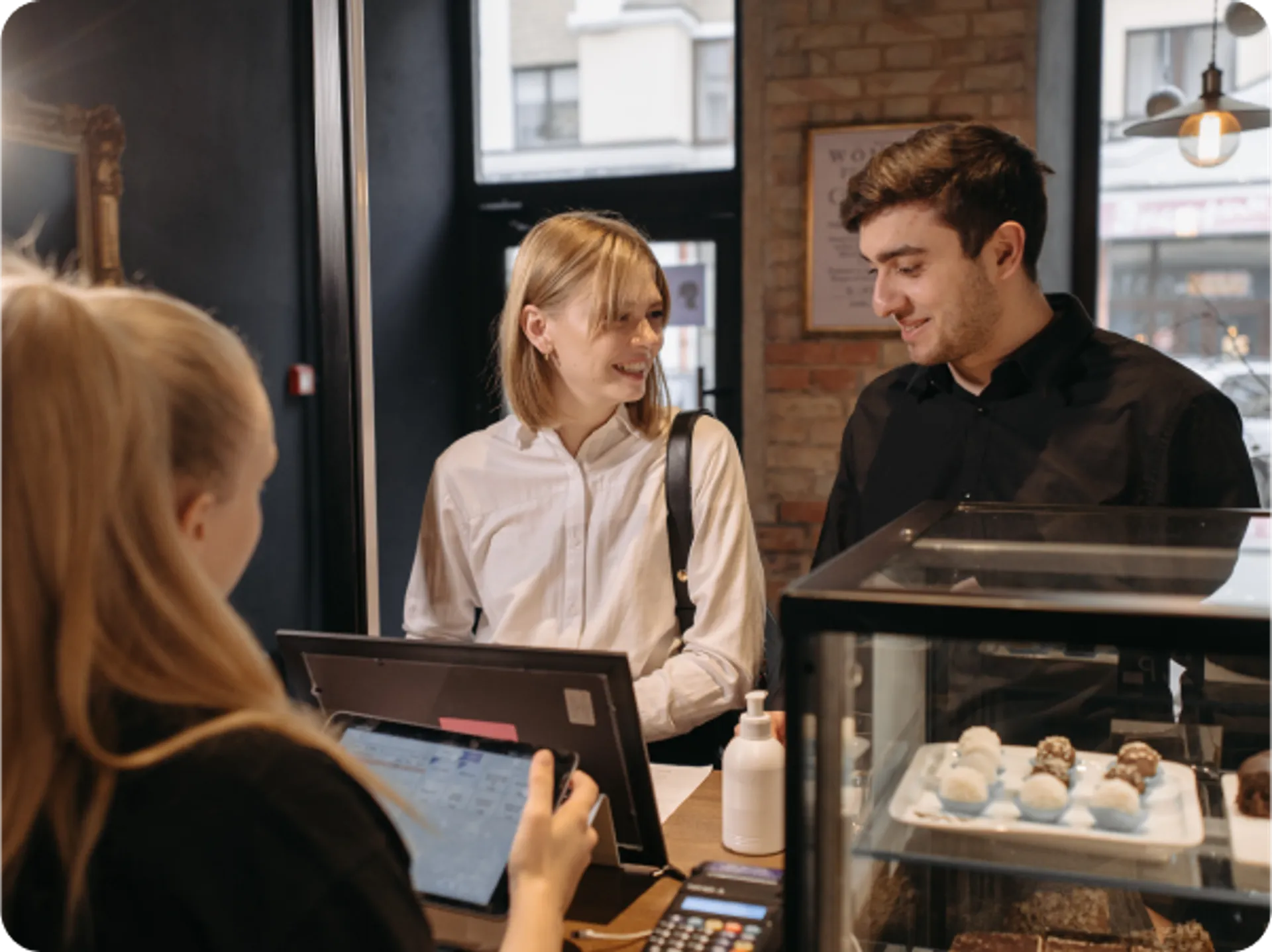 Seamless order sending from FineDine to POS Integrations with man and woman in front of computer.