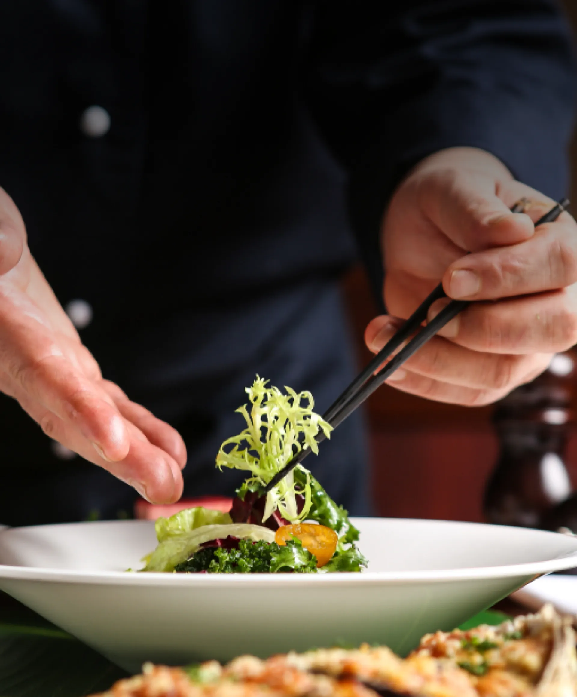 A tantalizing dish elegantly presented on a white plate, courtesy of a skilled chef at a fine dining restaurant.