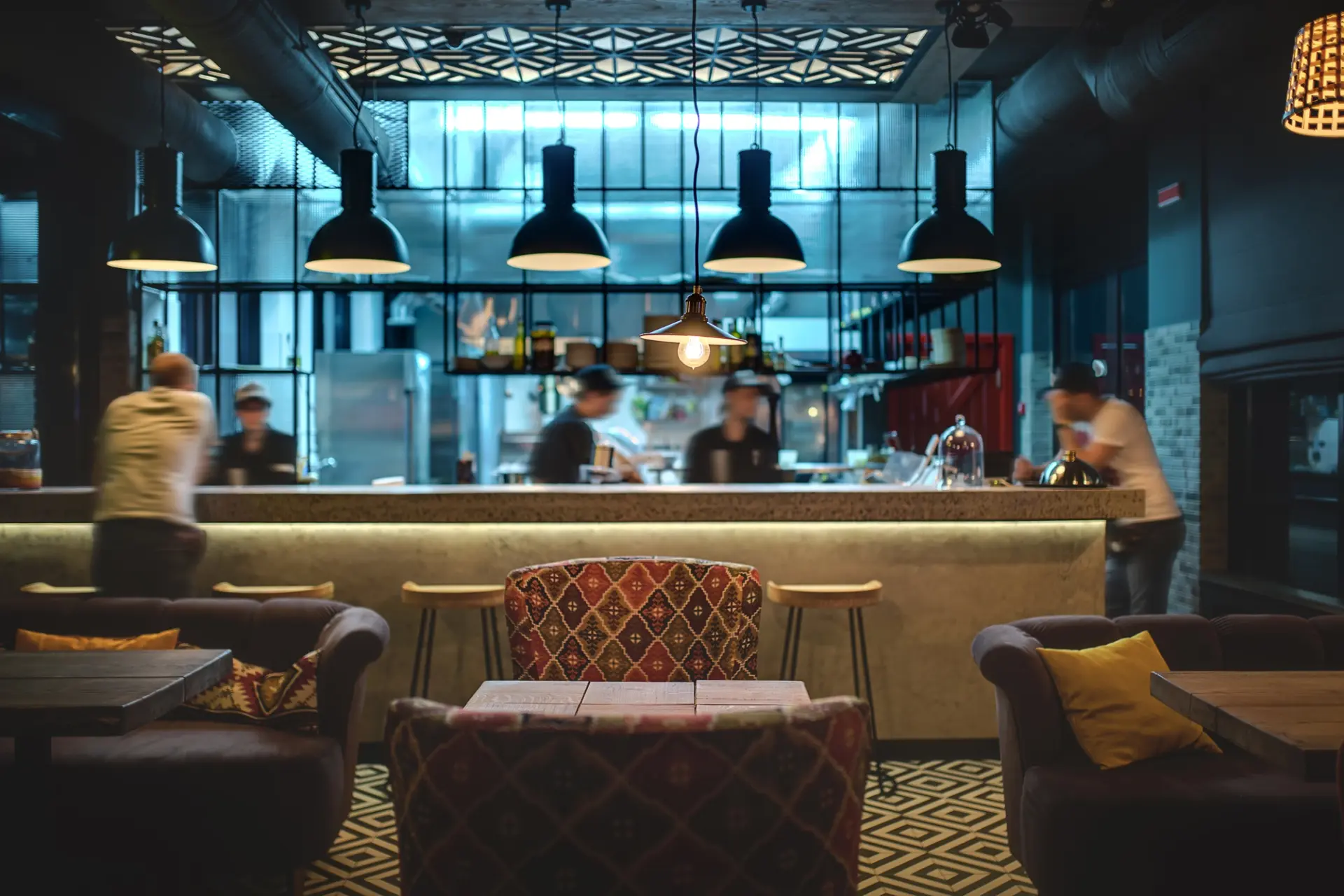 A stylish bar counter with chairs, perfect for a restaurant menu design.