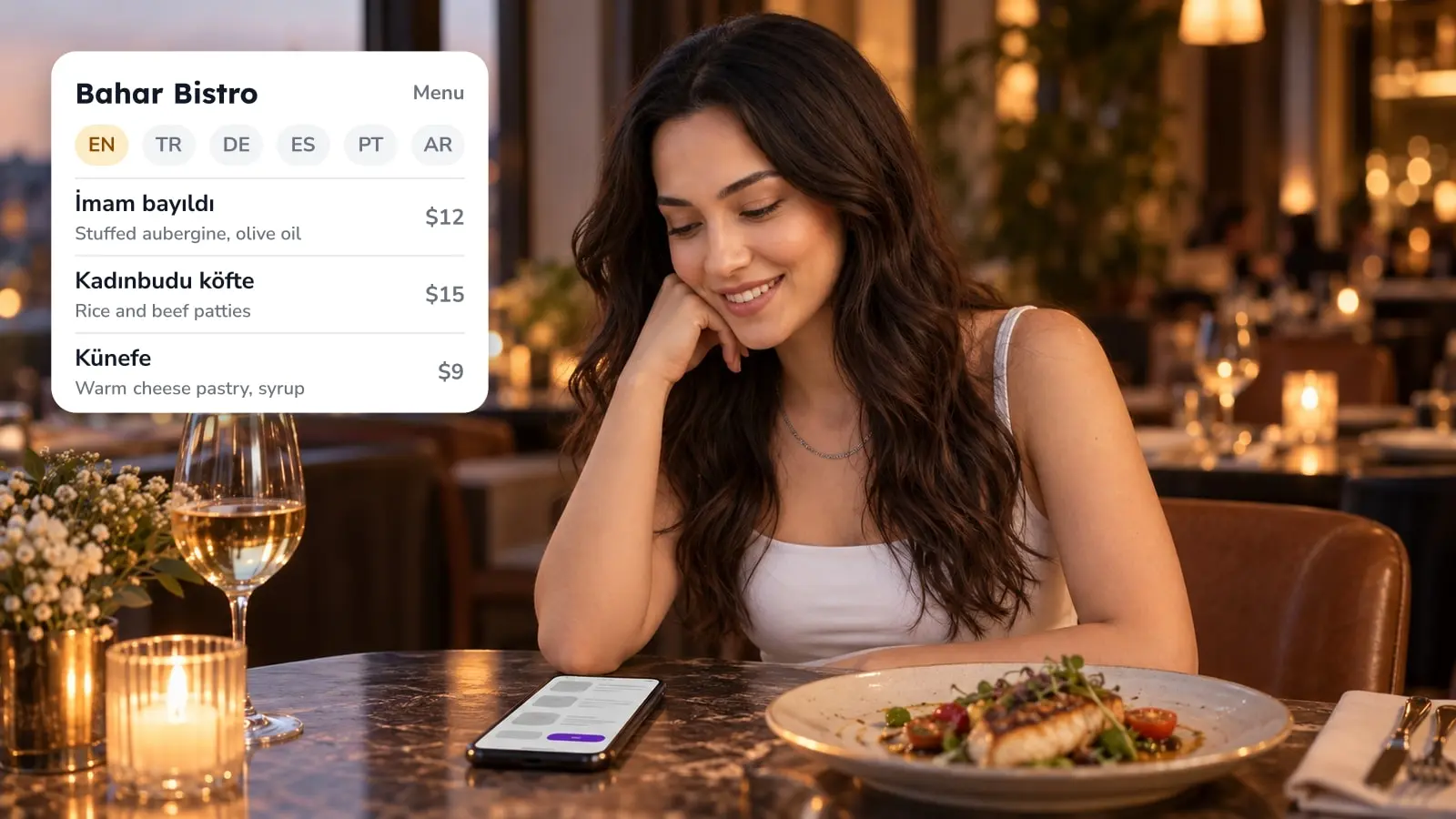 A woman smiles at a digital menu on her phone at a candlelit restaurant table, next to a menu card with six language options