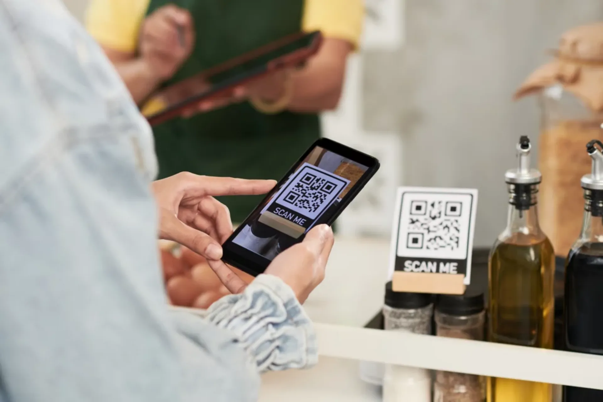 A QR code displayed on a smartphone indicating the availability of QR Code-Based Payments
