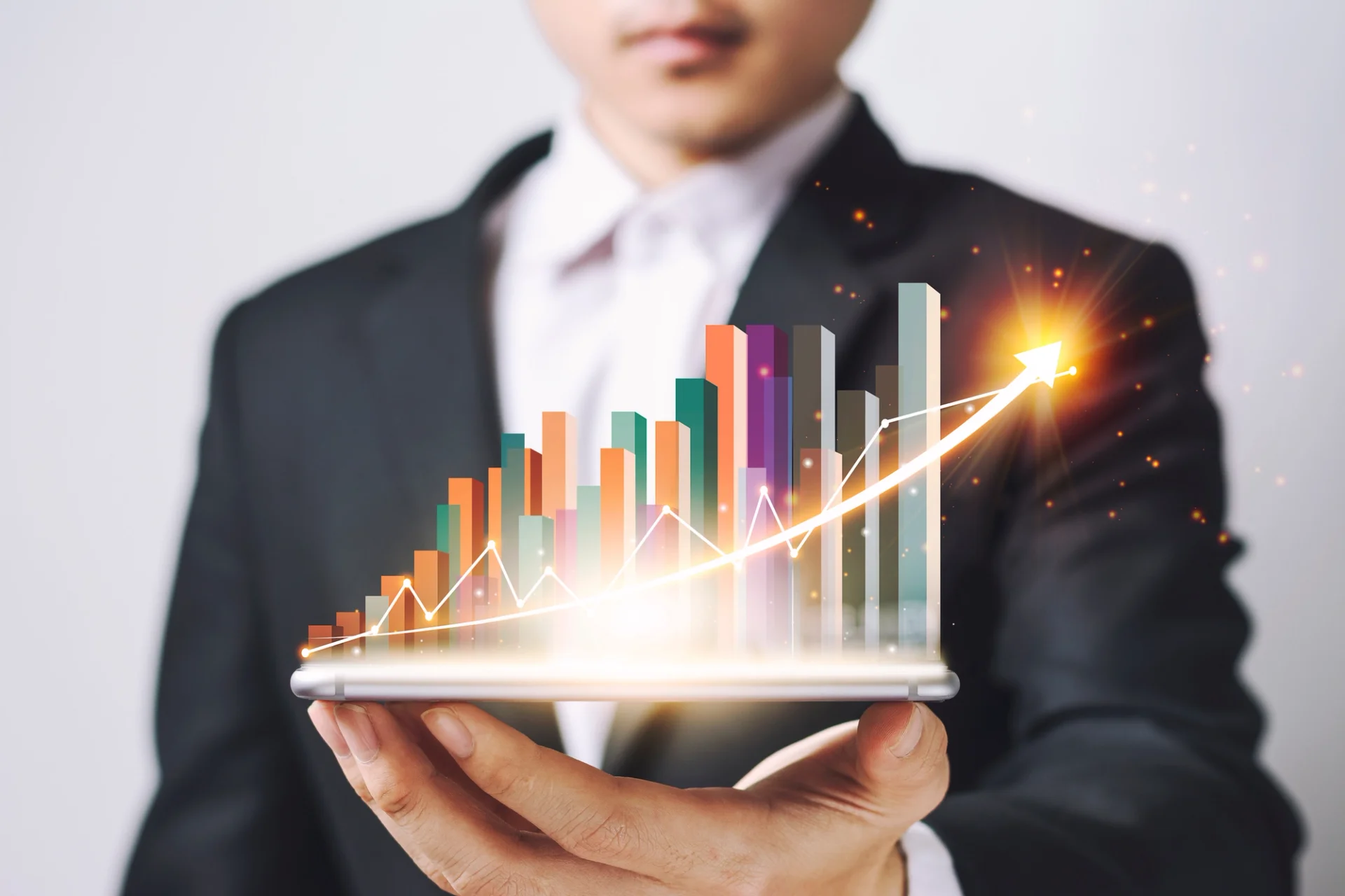 Businessman analyzing inventory turnover on tablet with graph chart.