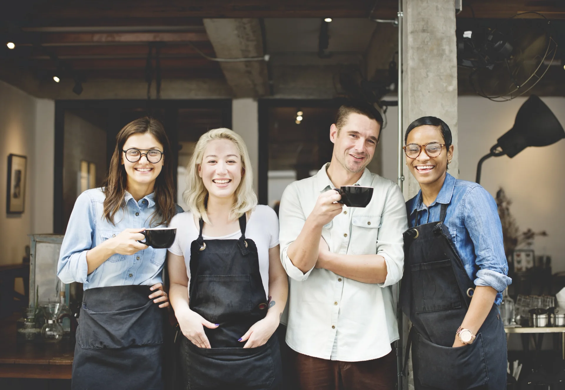 Coffee shop employees using digital ordering.