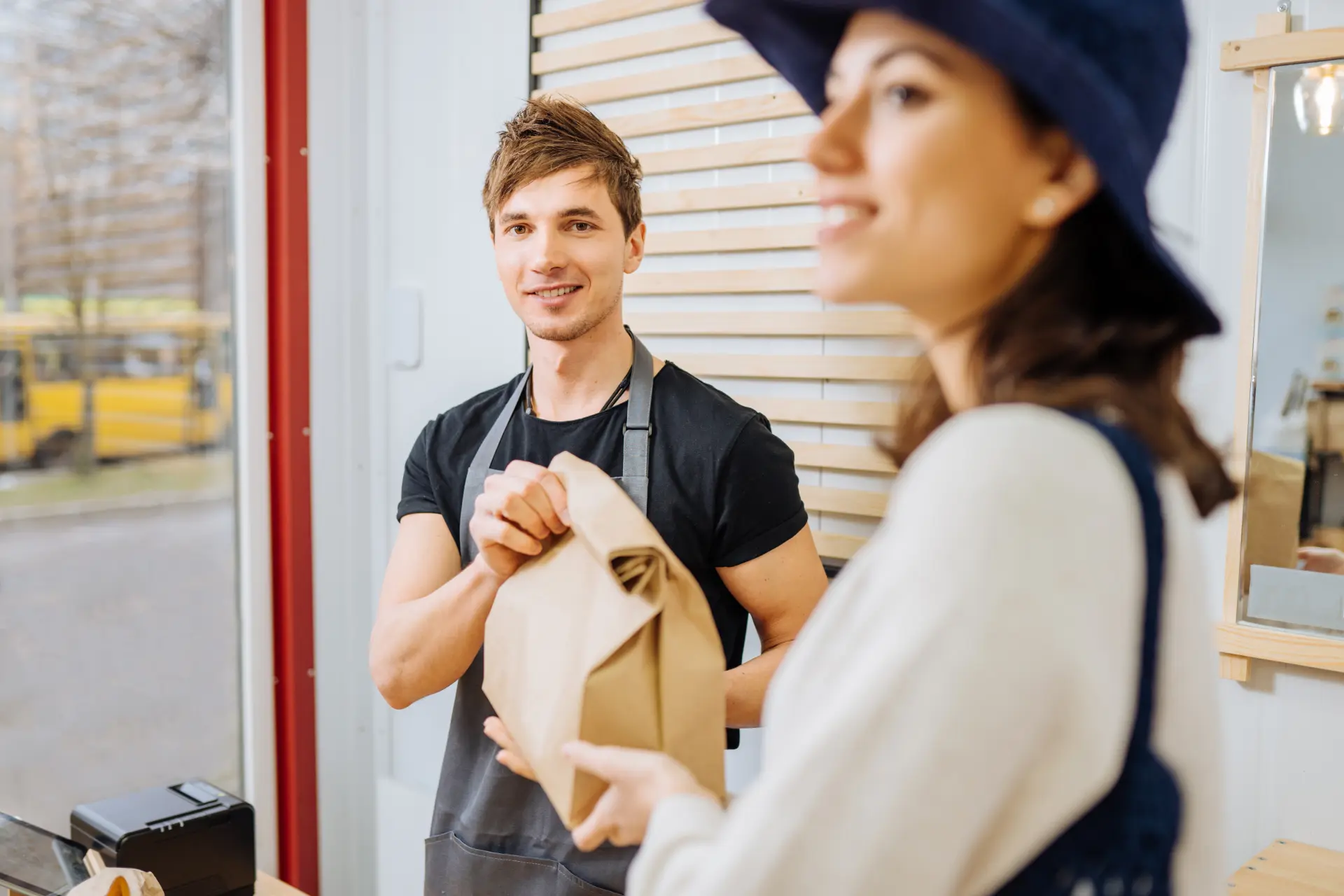 An image of a man and woman standing in front of a window, representing enhanced customer service.