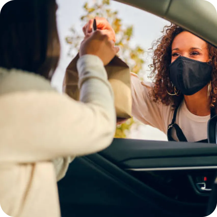 Waiter delivering to the car, drivethru menu