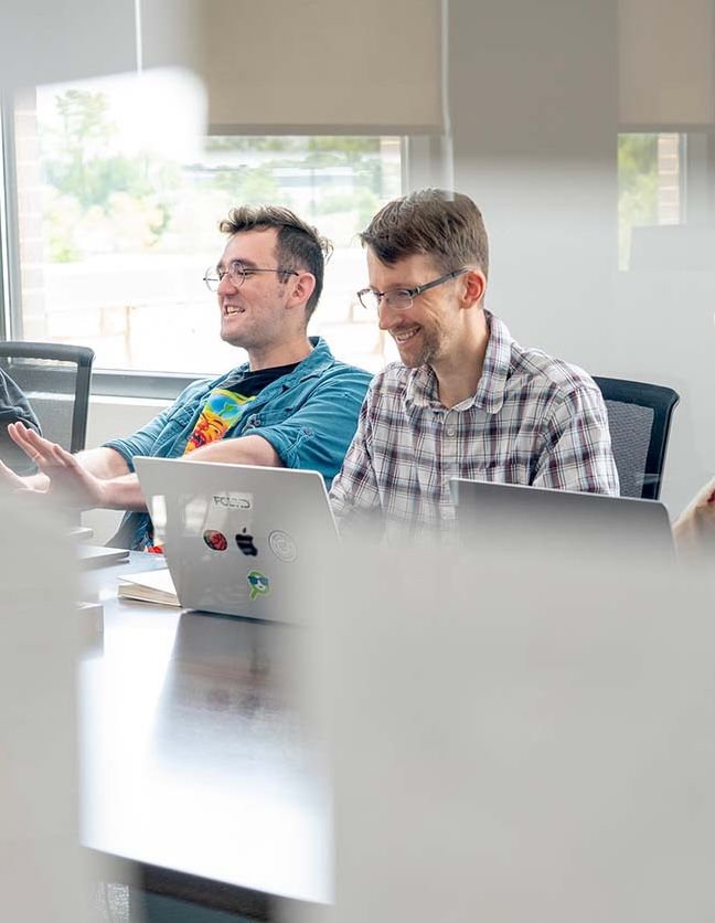 Found Search Marketing team members meeting at the office