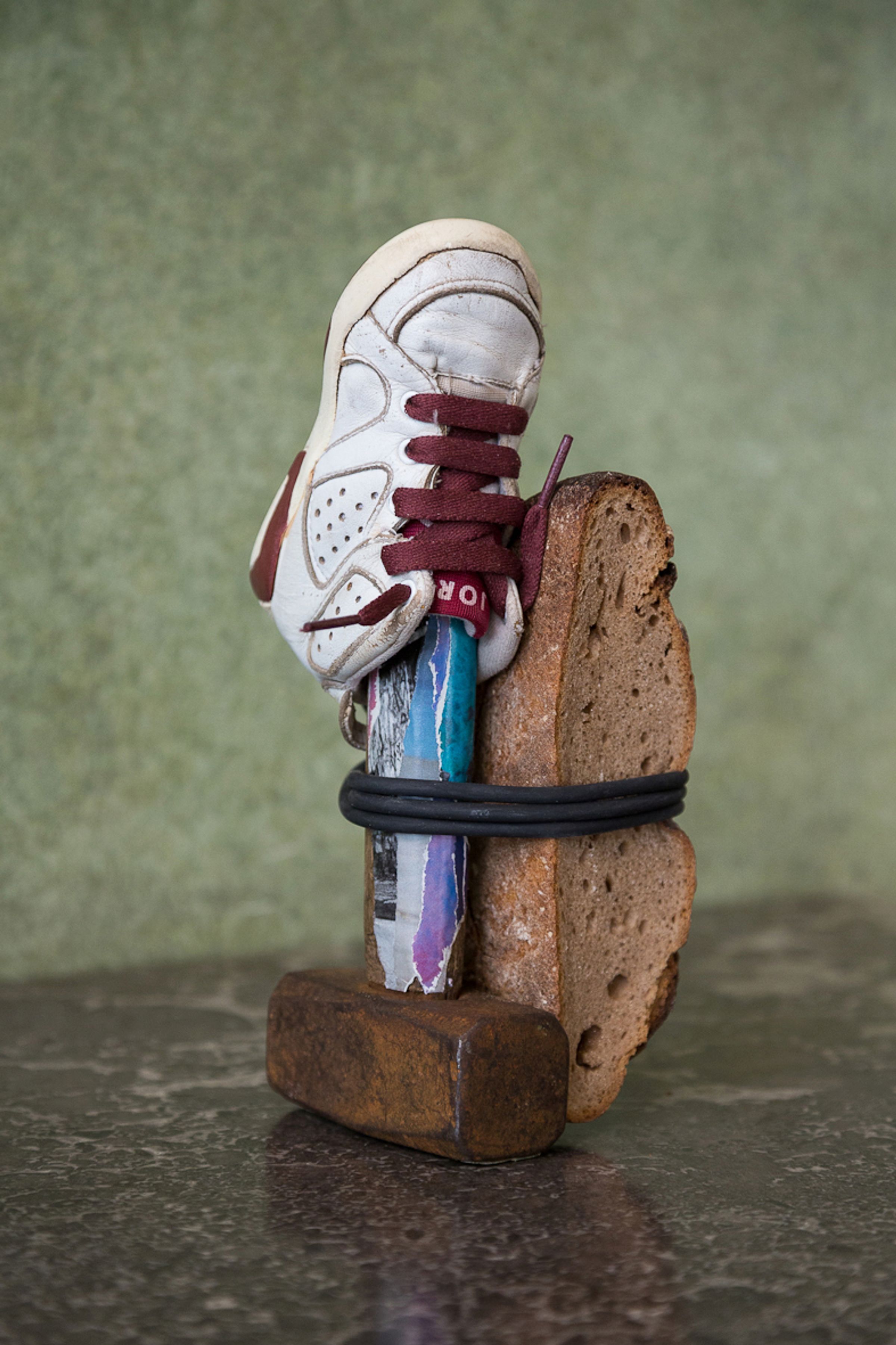 Deborah Ligorio, Survival Kit - Fabio 1/99, 2012, hammer, baby Nike Jordan shoe, bread, rubber band, 25 x 11 x 12 cm