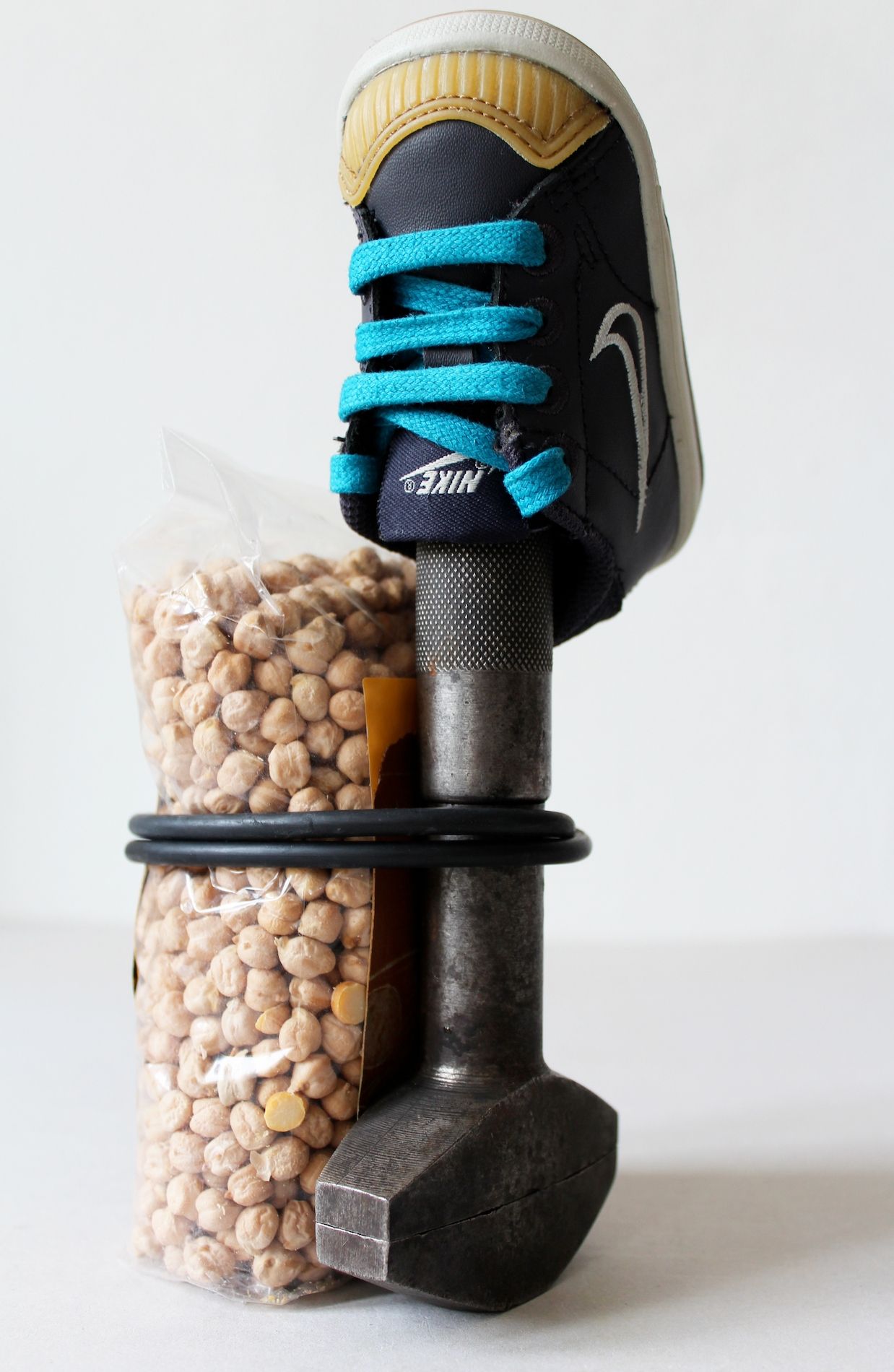 Deborah Ligorio, Survival Kit - Fabio 2/99, 2013, metal clamp, baby Nike-shoe, chickpeas pack, rubber band, 11x12x19 cm