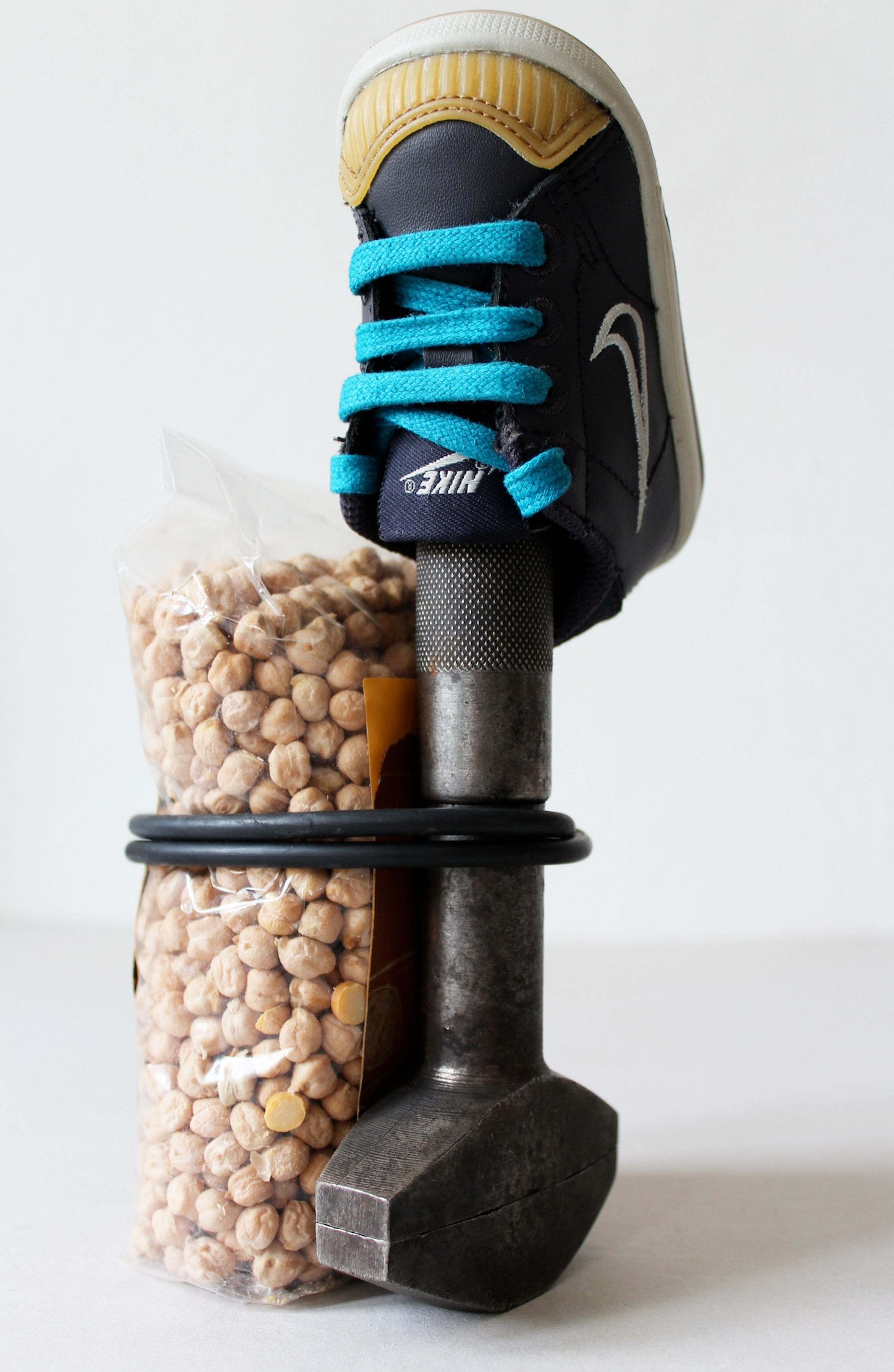 Deborah Ligorio, Survival Kit - Fabio 2/99, 2013, metal clamp, baby Nike-shoe, chickpeas pack, rubber band, 11x12x19 cm