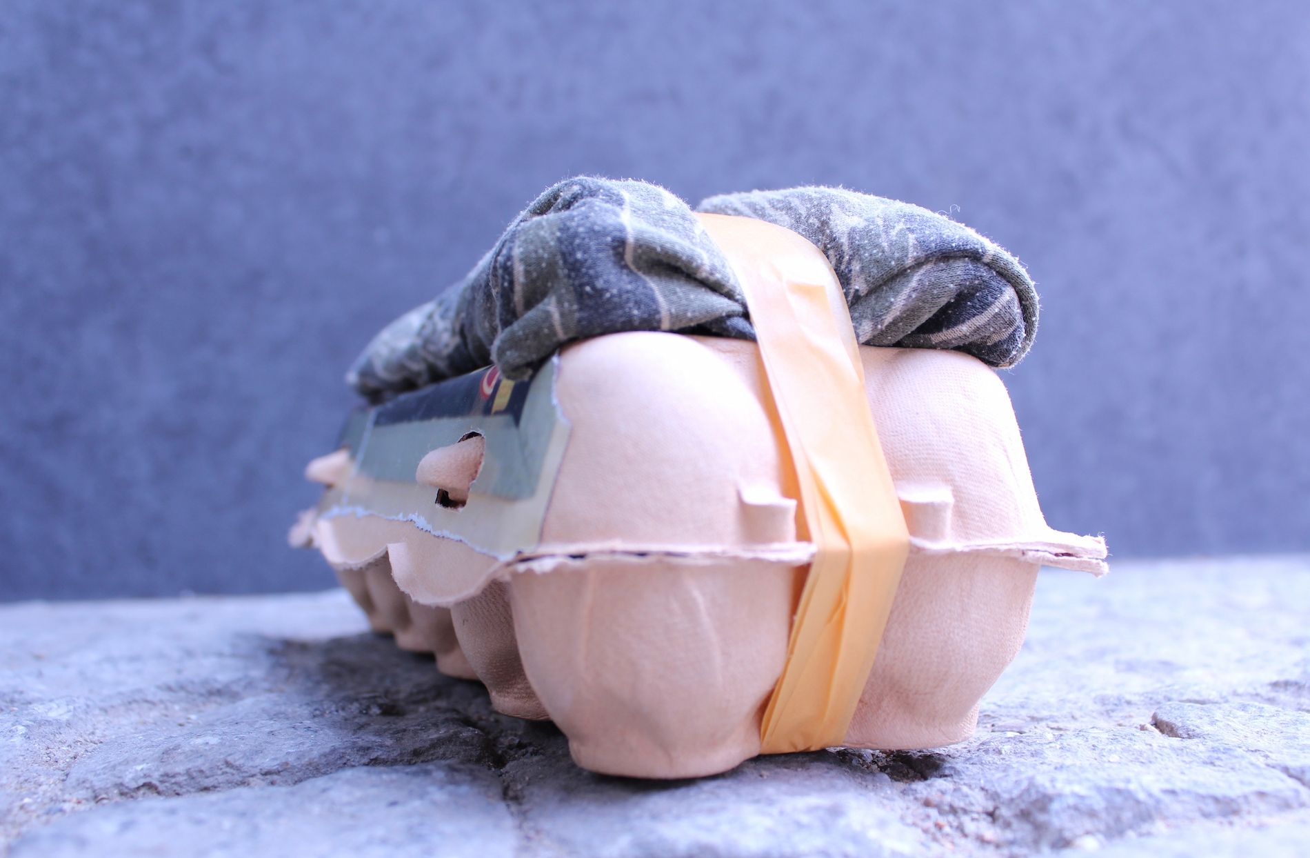 Deborah Ligorio, Survival Kit - Bellissima 3/99, 2013, assemblage: egg box, fabric, masking tape, 25 x 12 x 11 cm.