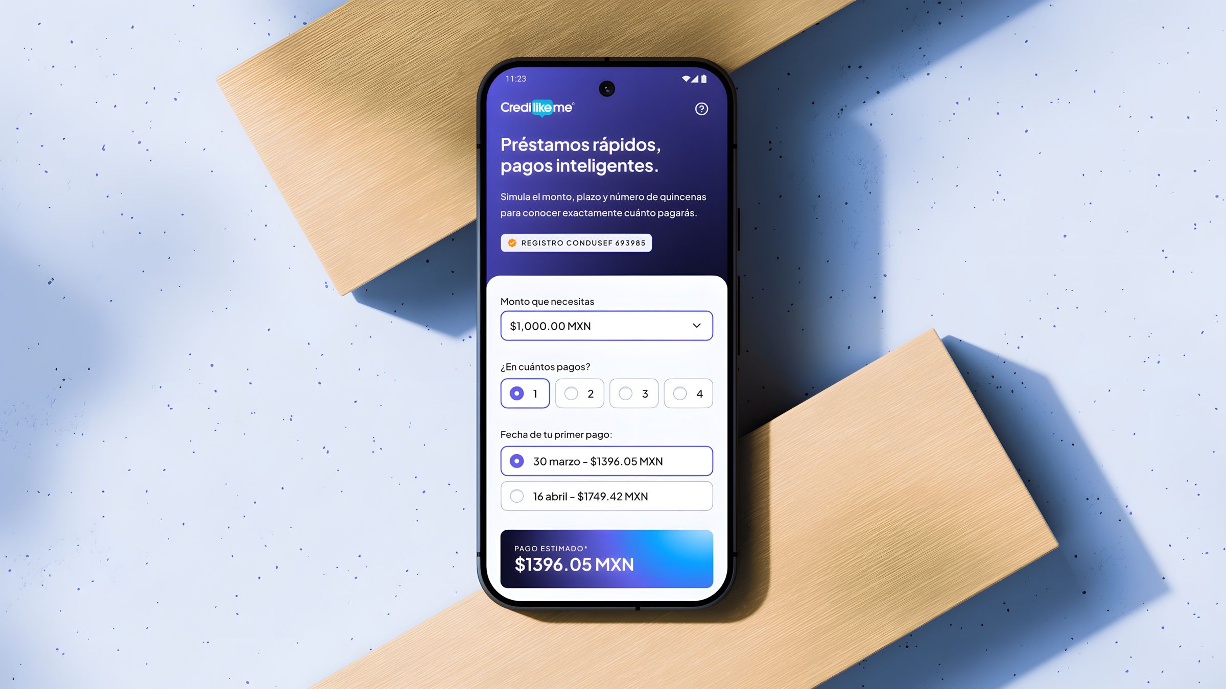 Credilikeme loan simulator mobile interface mockup displayed on a wooden geometric surface.
