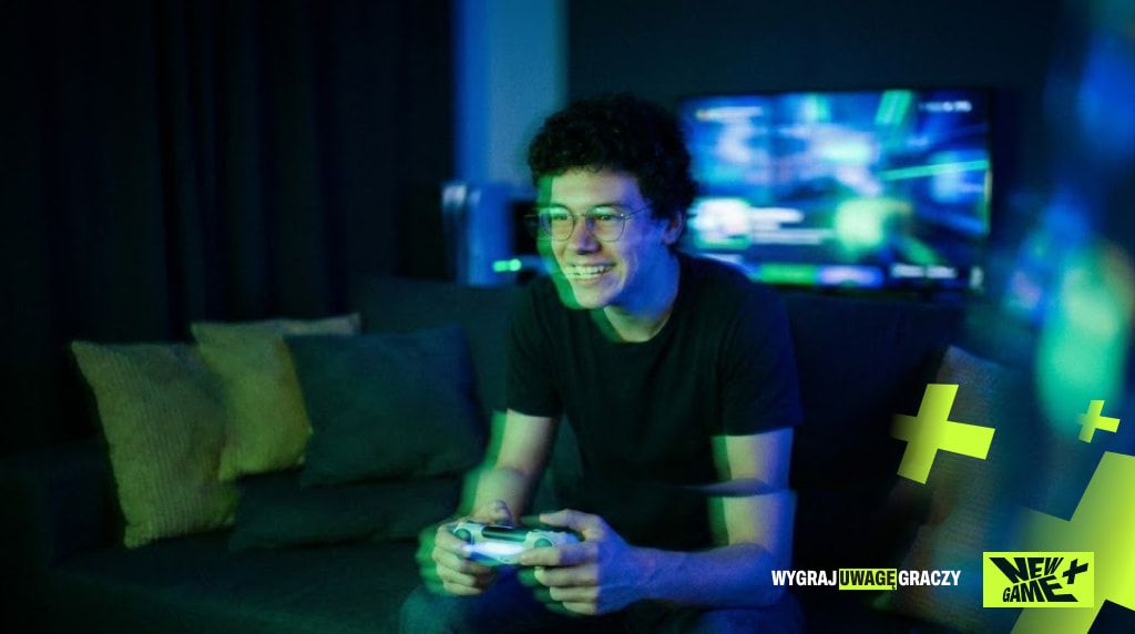 Young man playing on a console