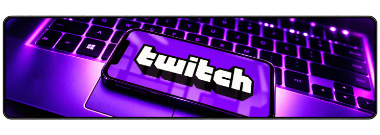 Twitch logo displayed on a smartphone placed on a purple gaming keyboard.