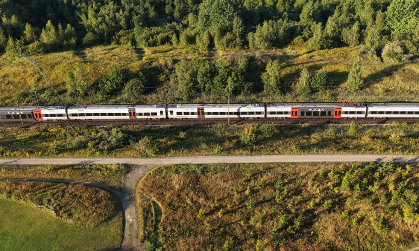 This comundo blog post about the GHG protocol has a main image showing a train speeding through the countryside. It's a photo from a drone, so we're looking down on to the train, and it's surrounded completely by greenery. It's Sweden or Denmark, I'm unsure of which.