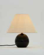 Table Lamp designed by Marie-Anne Derville, with a round wooden base and silk lampshades, photographed in the gallery