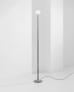 A floorlamp designed by French designer Edgar Jayet, made of hammered iron.