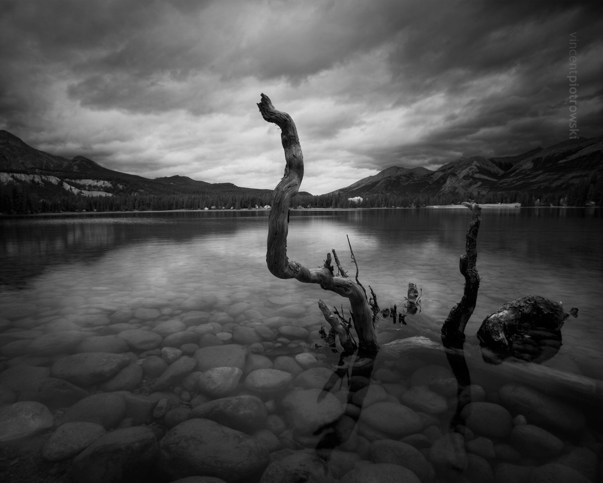 A moody photograph of Annette Lake in Jasper National Park