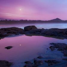 A full moon reflected over a still tide pool taken near Tofino BC