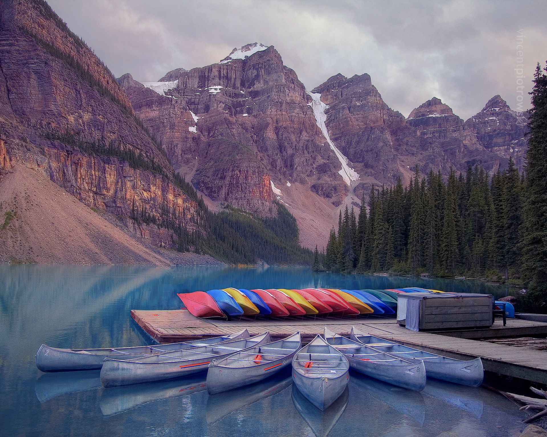 Kayak and canoes in front of Moraine Lake Alberta