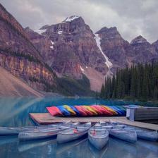 Kayak and canoes in front of Moraine Lake Alberta