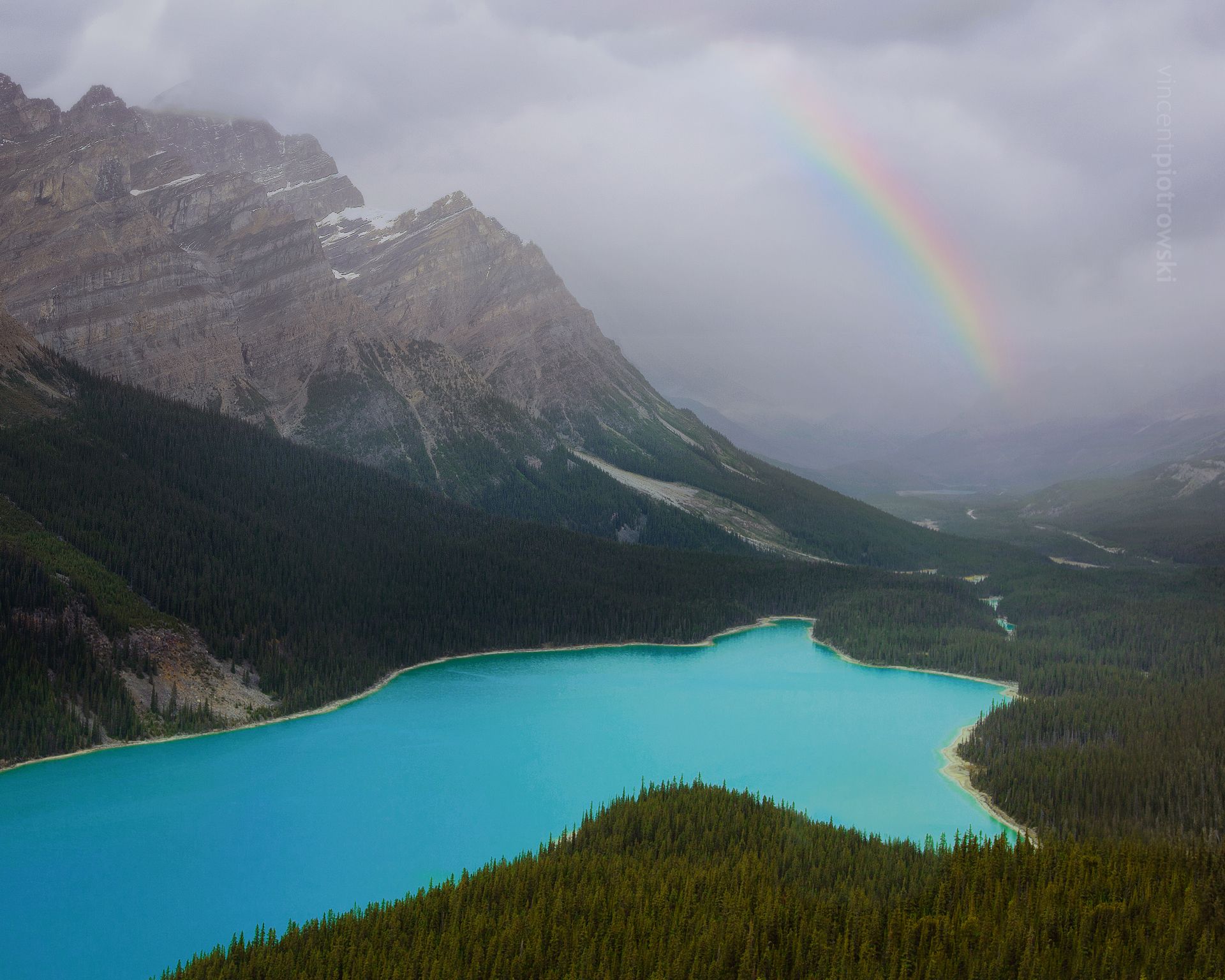 A rainbow over Peyto Lake along Icefields Parkway in Alberta