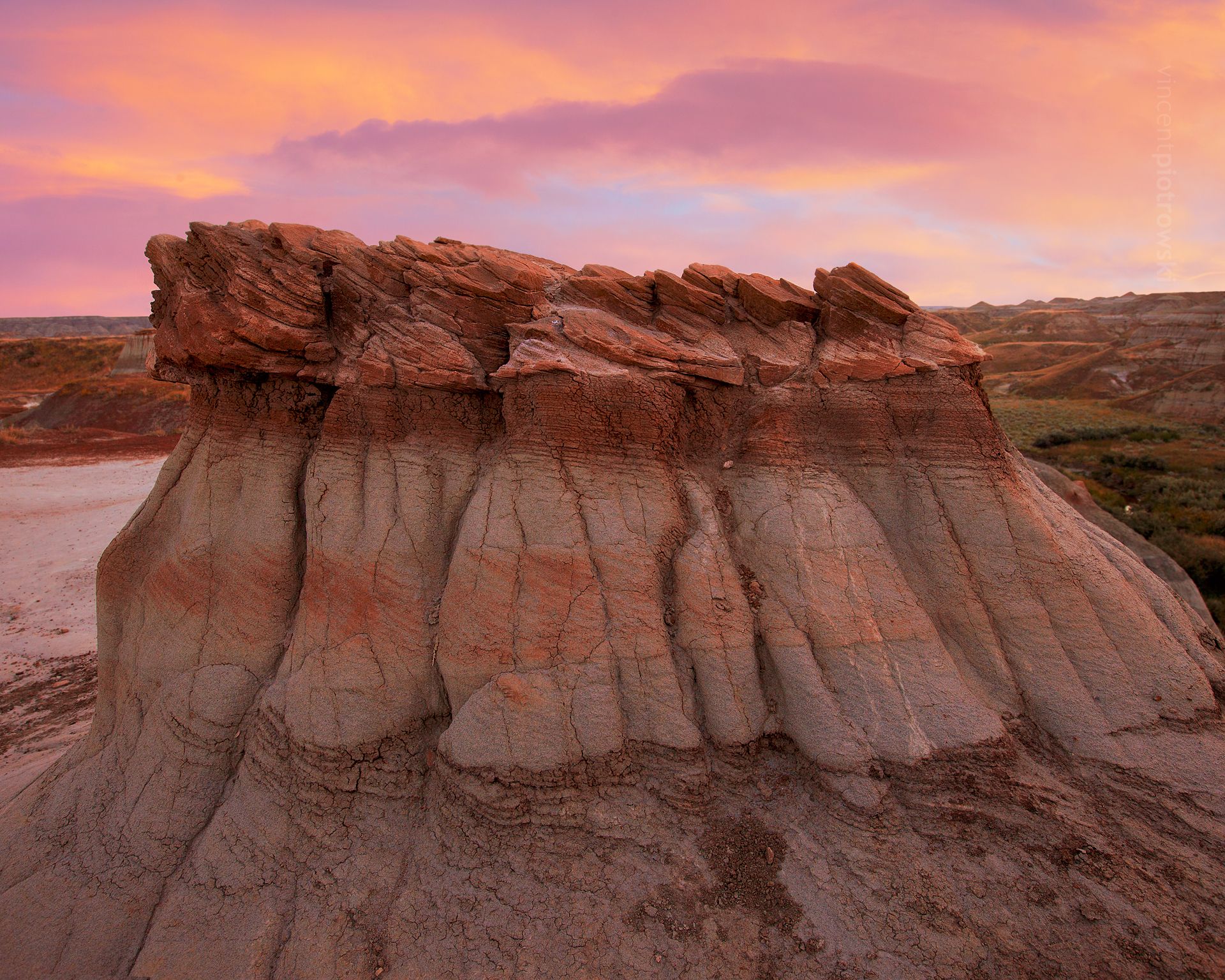 Hoodoos in Alberta's Badlands showcasing warm summer colours