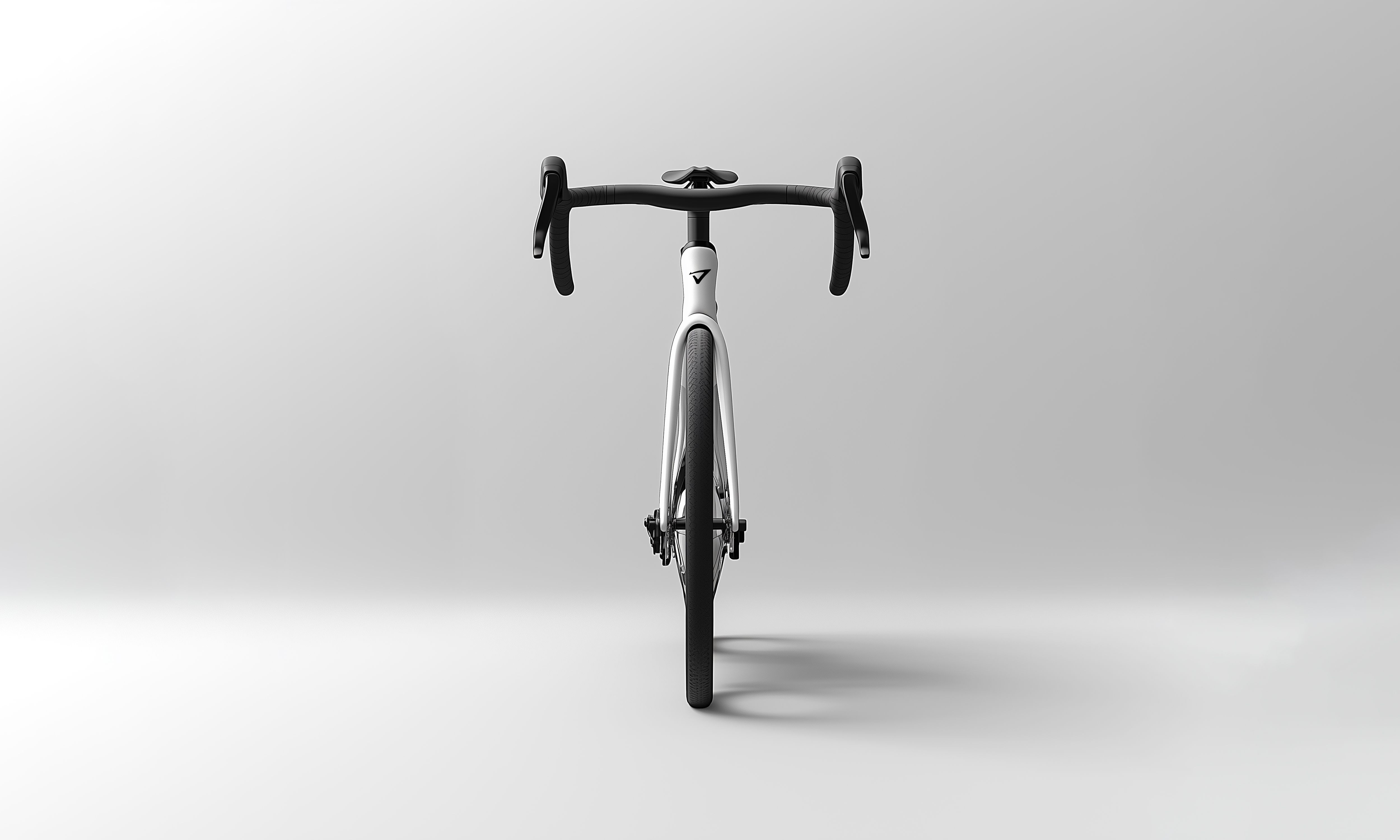 a white bicycle is sitting on a white surface .