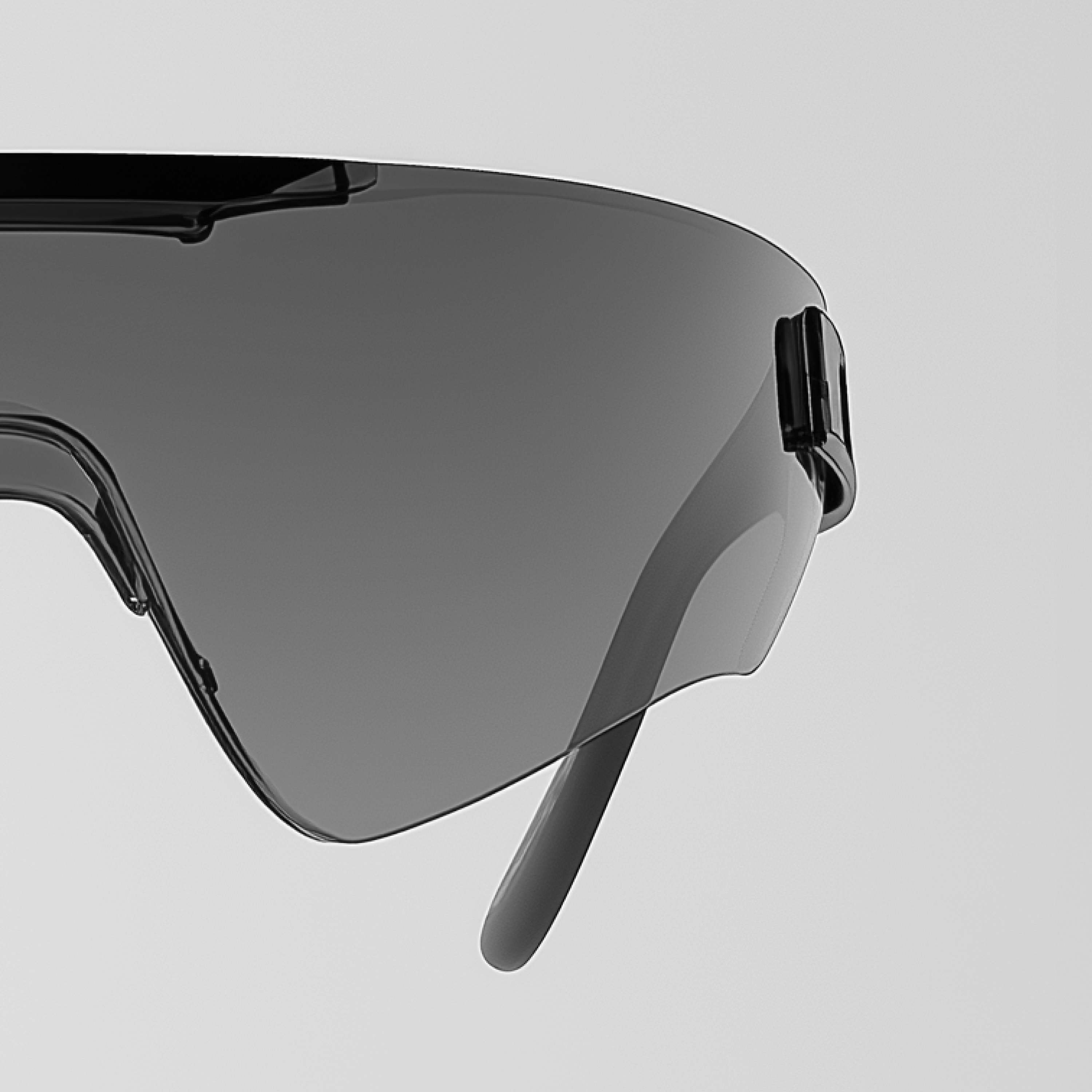 a pair of black sunglasses with a gray lens