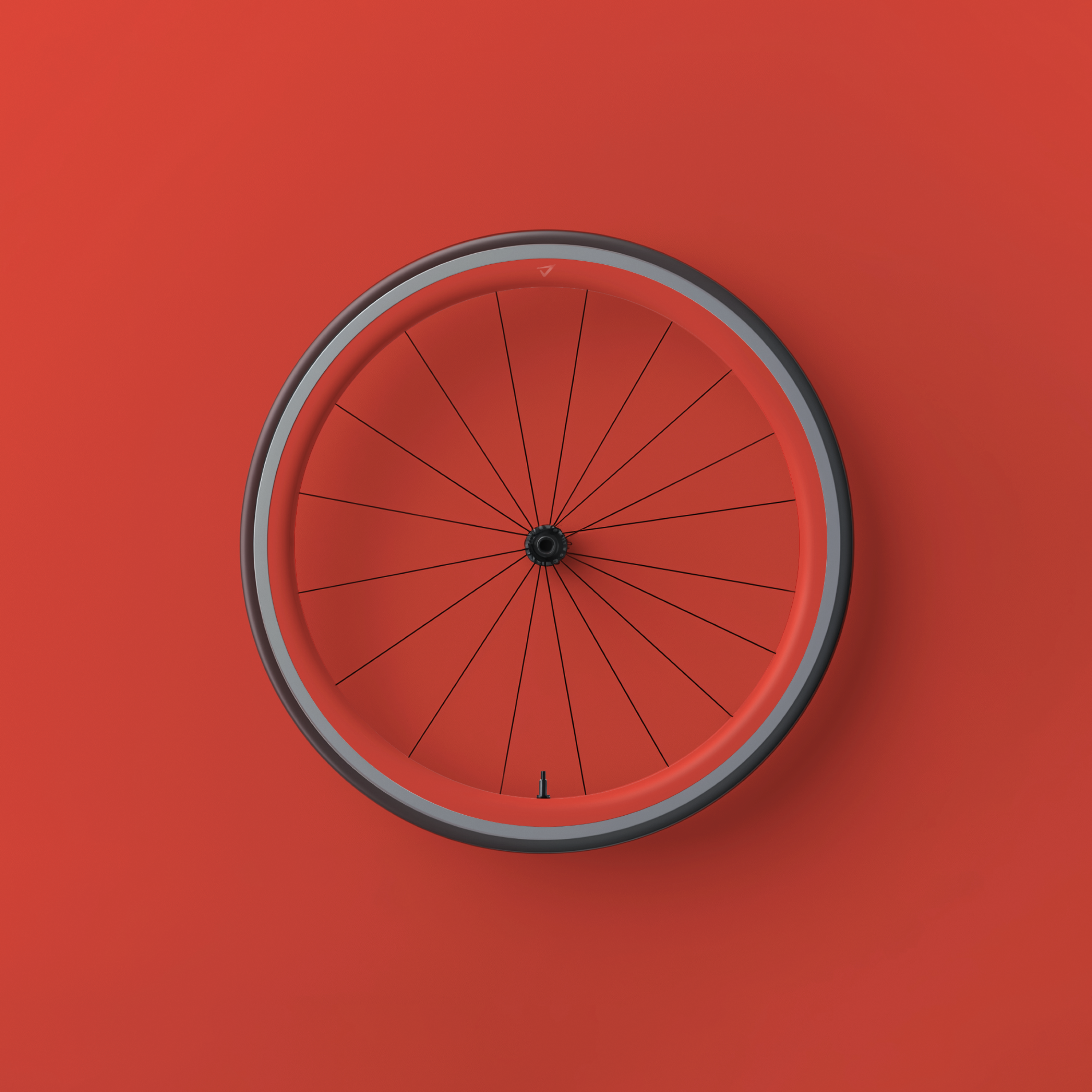 a red bicycle wheel is against a red background
