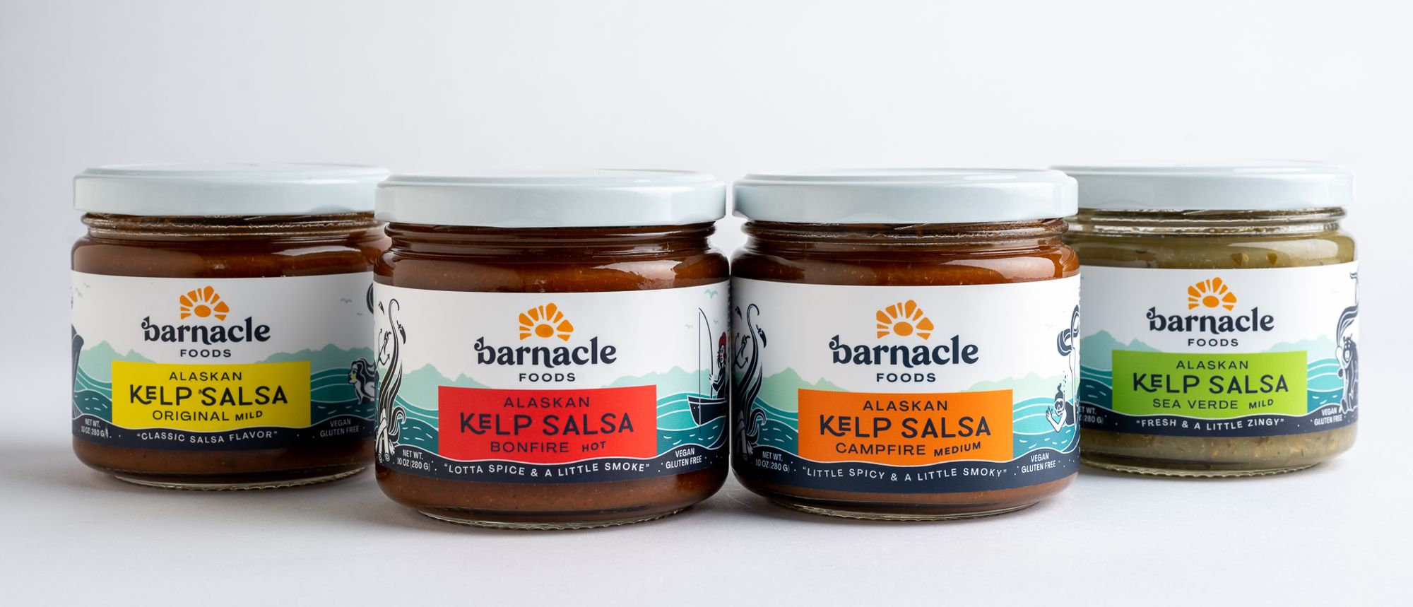 Salsa jars lined up with brightly colored labels