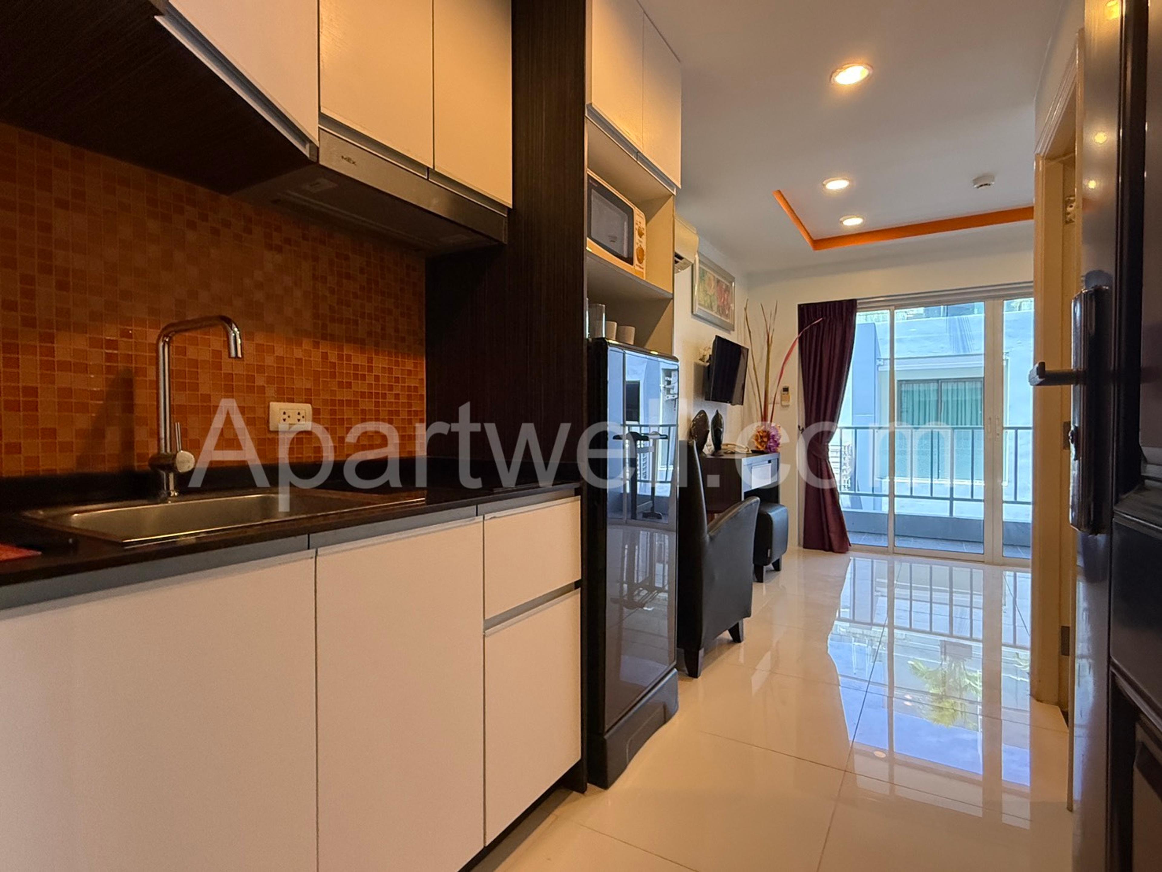 Kitchen and living area in a New Nordic Suites 5 apartment