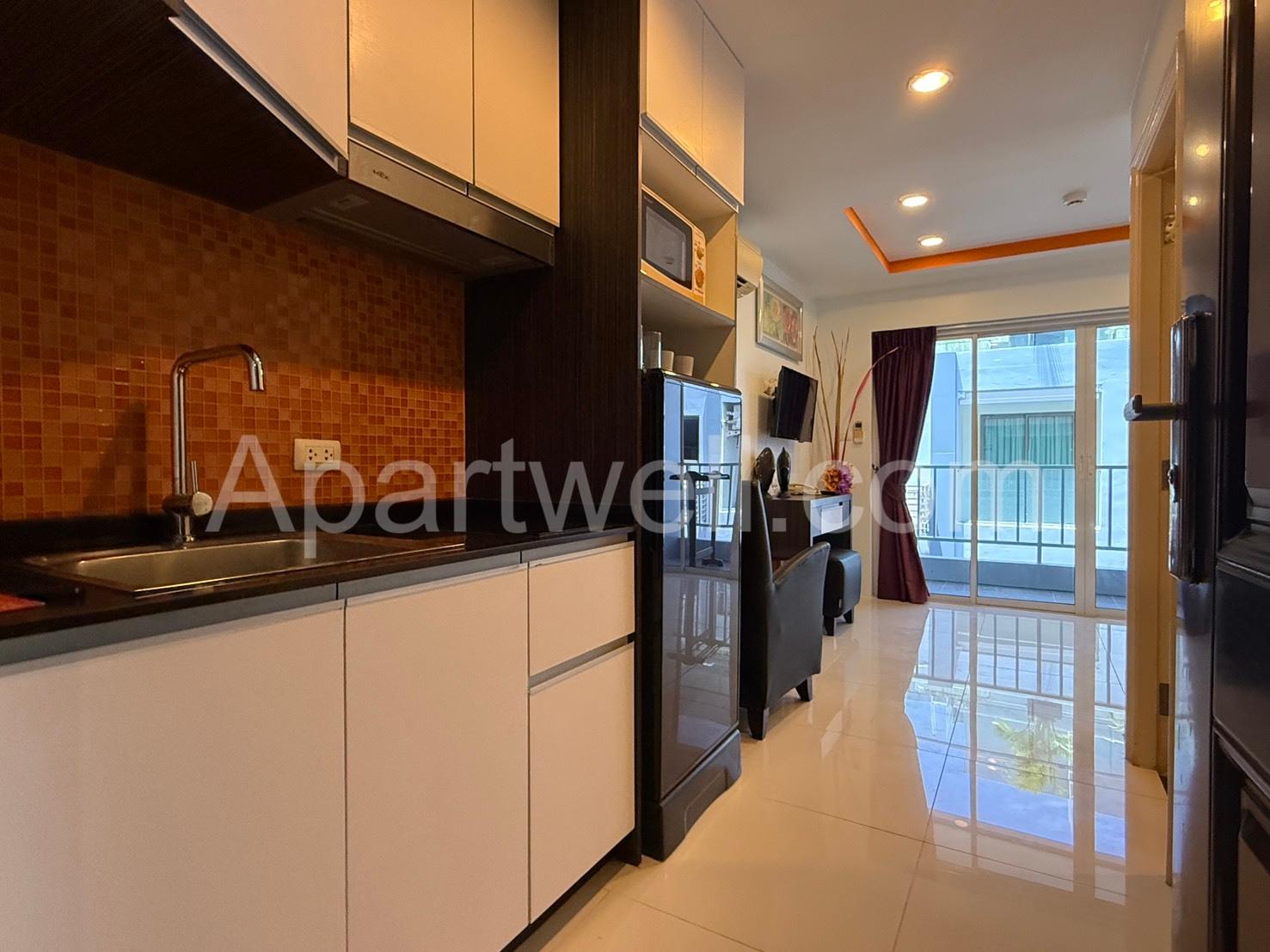 Kitchen and living area in a New Nordic Suites 5 apartment