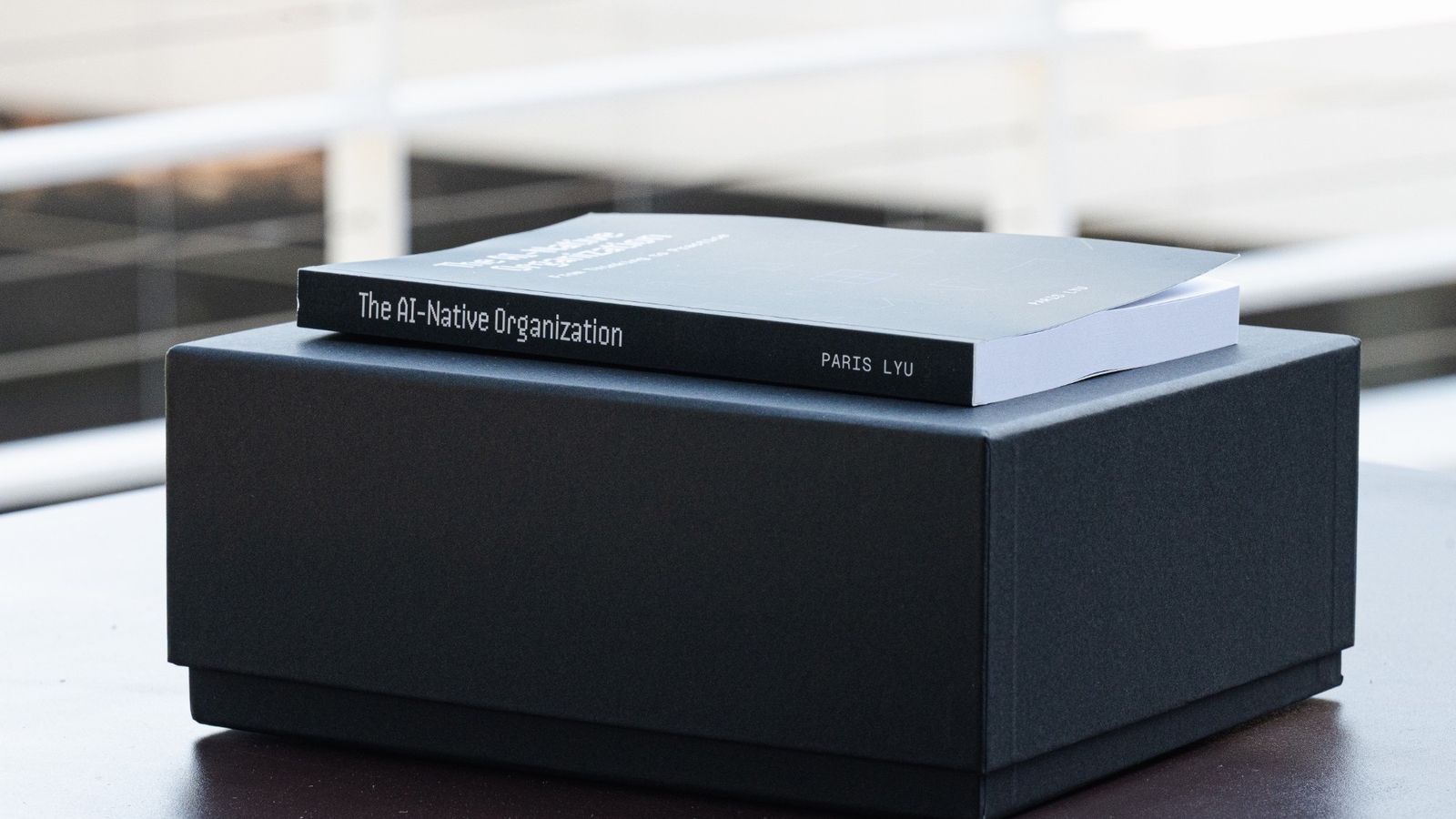 The AI-Native Organization resting on its gift box, spine visible
