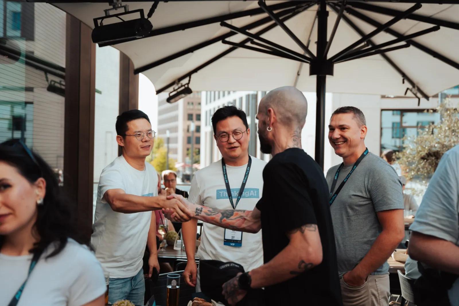 Guests shaking hands on the terrace