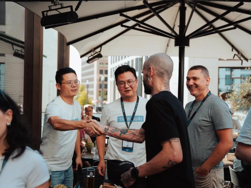 Guests shaking hands on the terrace