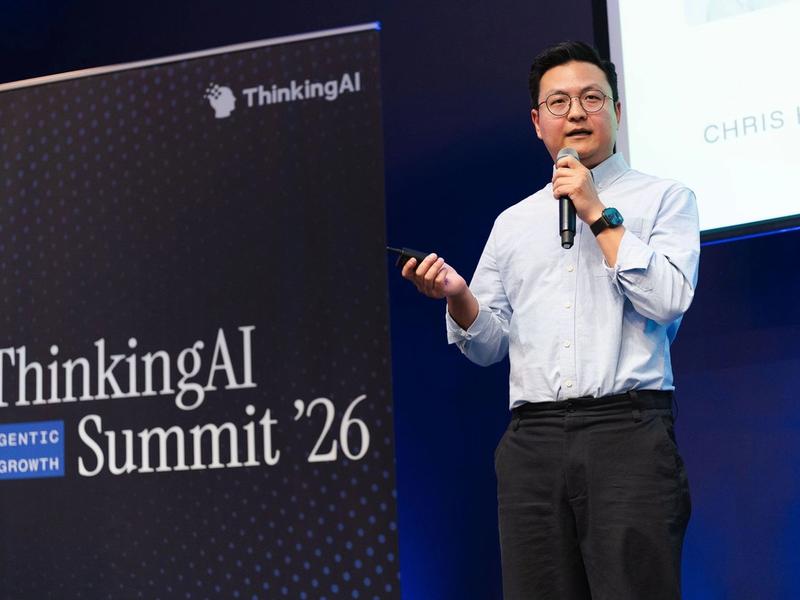 Chris Han on stage opening the summit