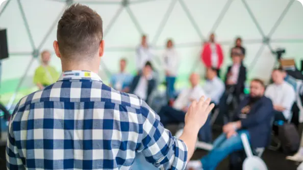 Speaker presenting to conference audience