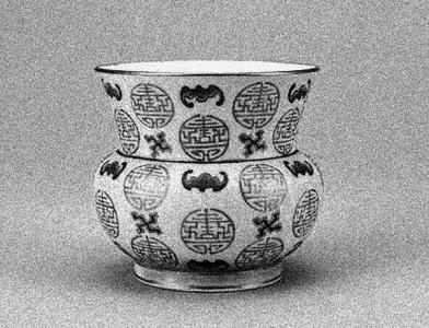 Picture of a Chinese porcelain vase with characters as pattern.