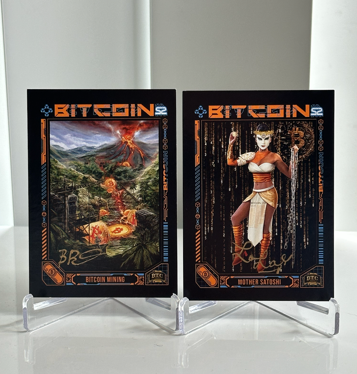 S2C2 + S2C15 | Autographed Mother Satoshi + Bob Burnett Lot