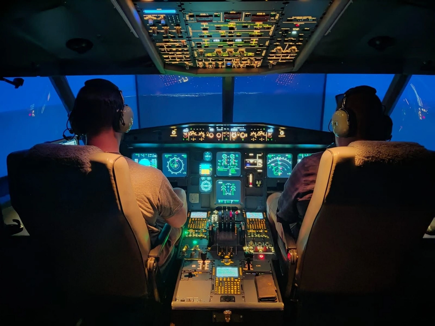 Image of two pilots in cockpit 