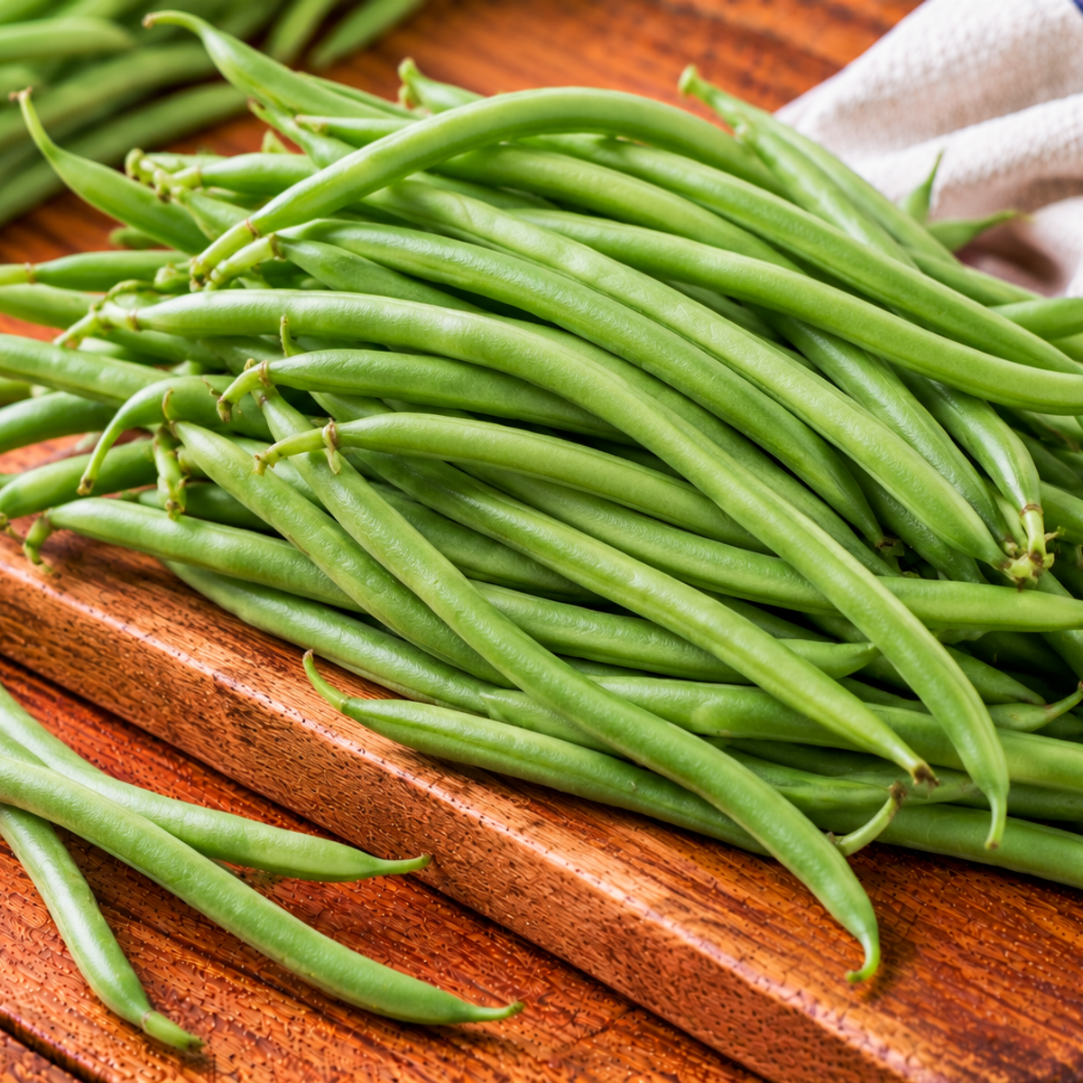 Slender green haricot bean pods with smooth surfaces