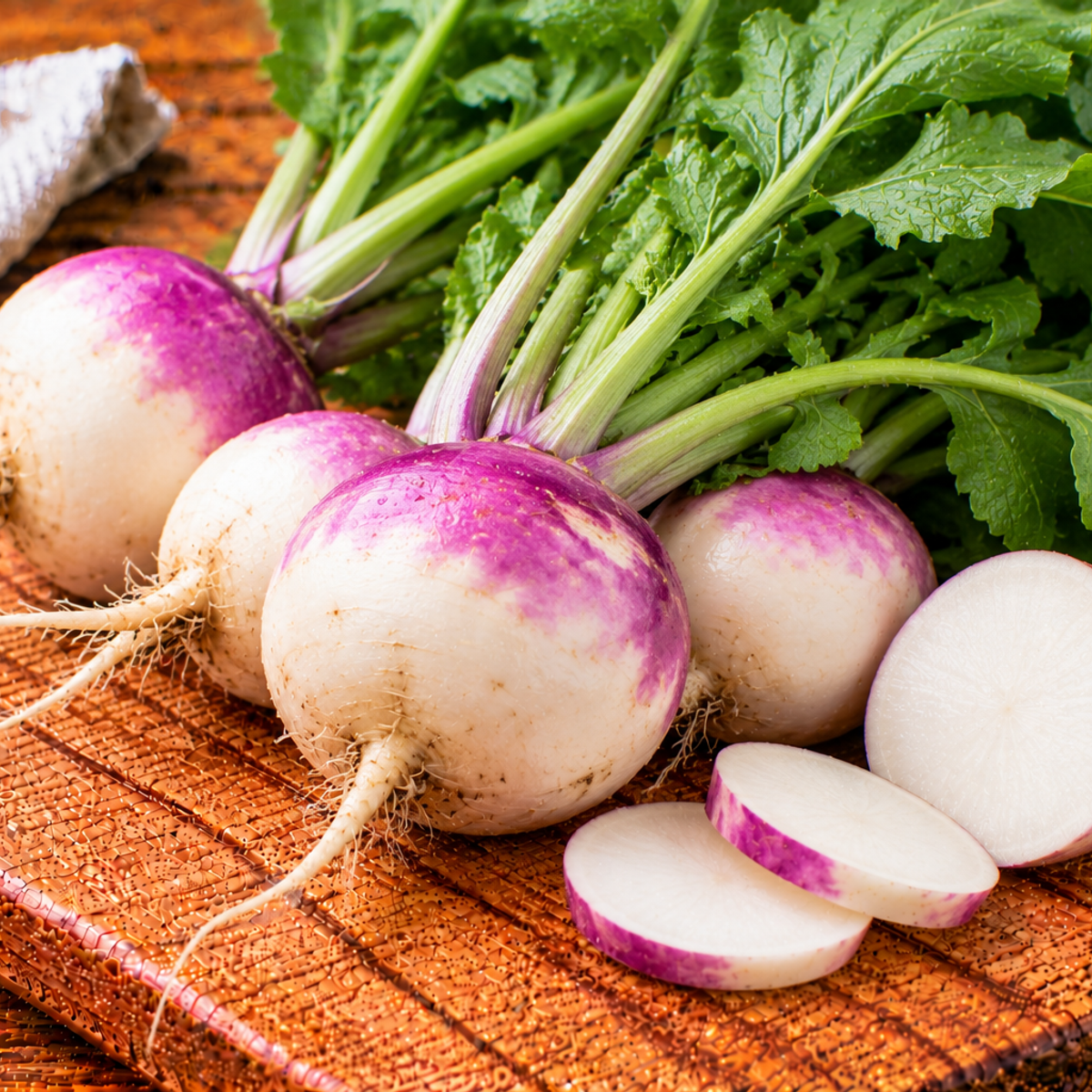 Turnips with round pale roots and purple shoulders