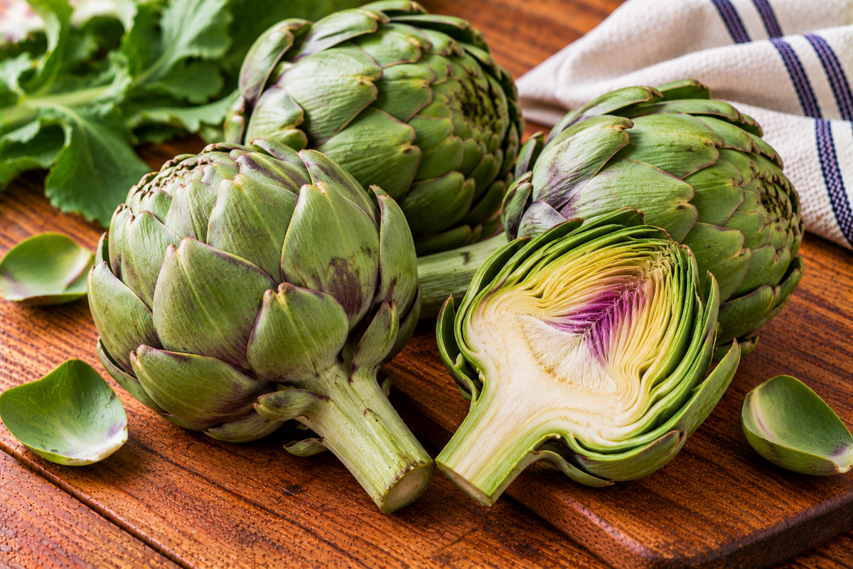Globe artichoke with layered green bracts around a rounded bud