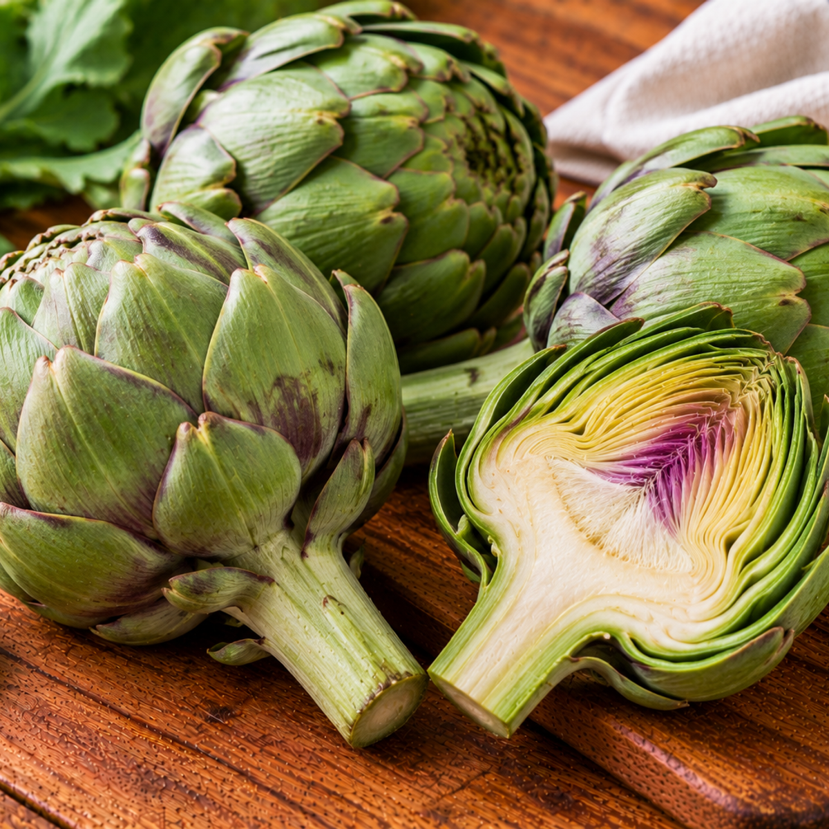 Globe artichoke with layered green bracts around a rounded bud