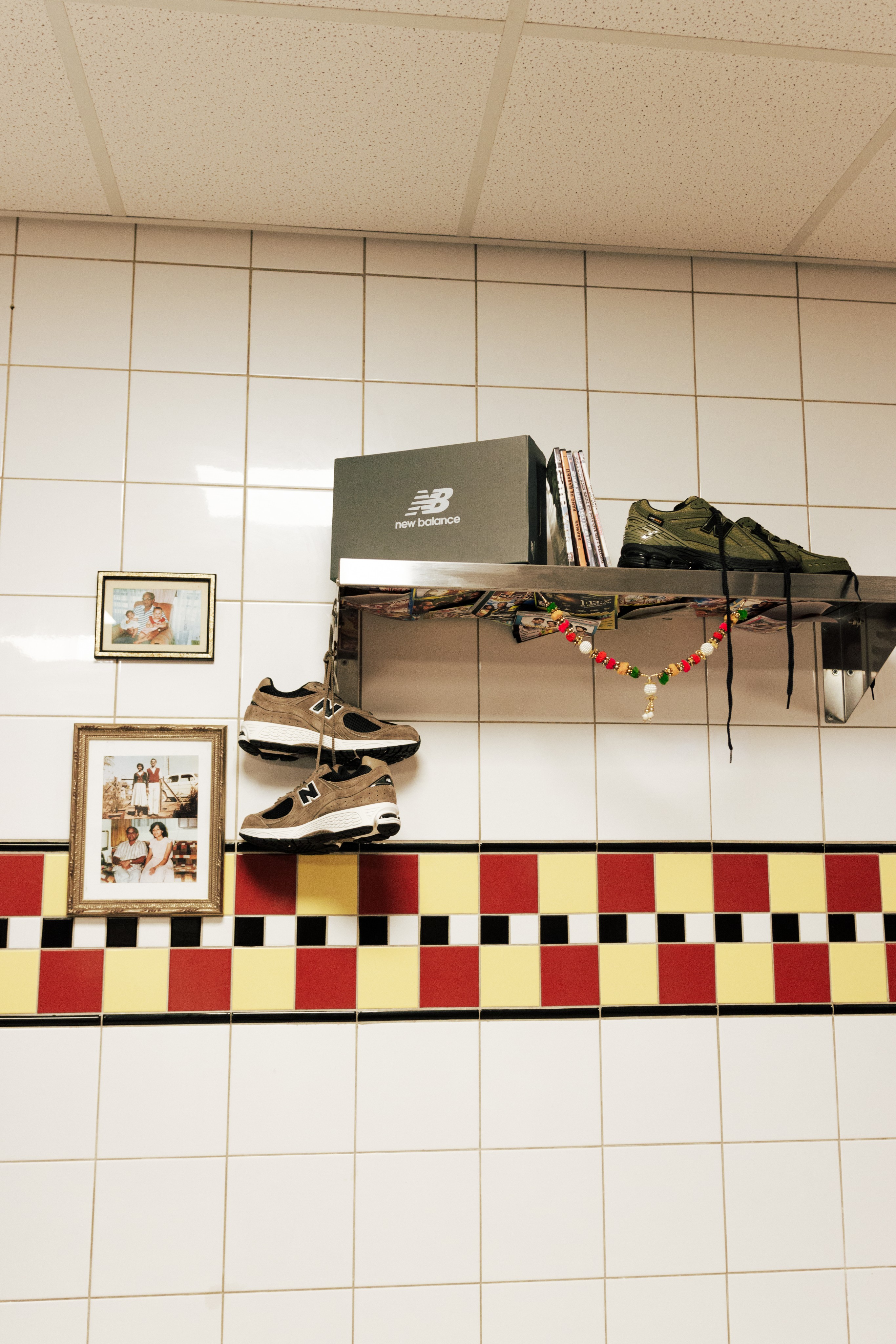 Interior of Derrels’ commercial kitchen with stainless-steel equipment and a chequerboard tile floor