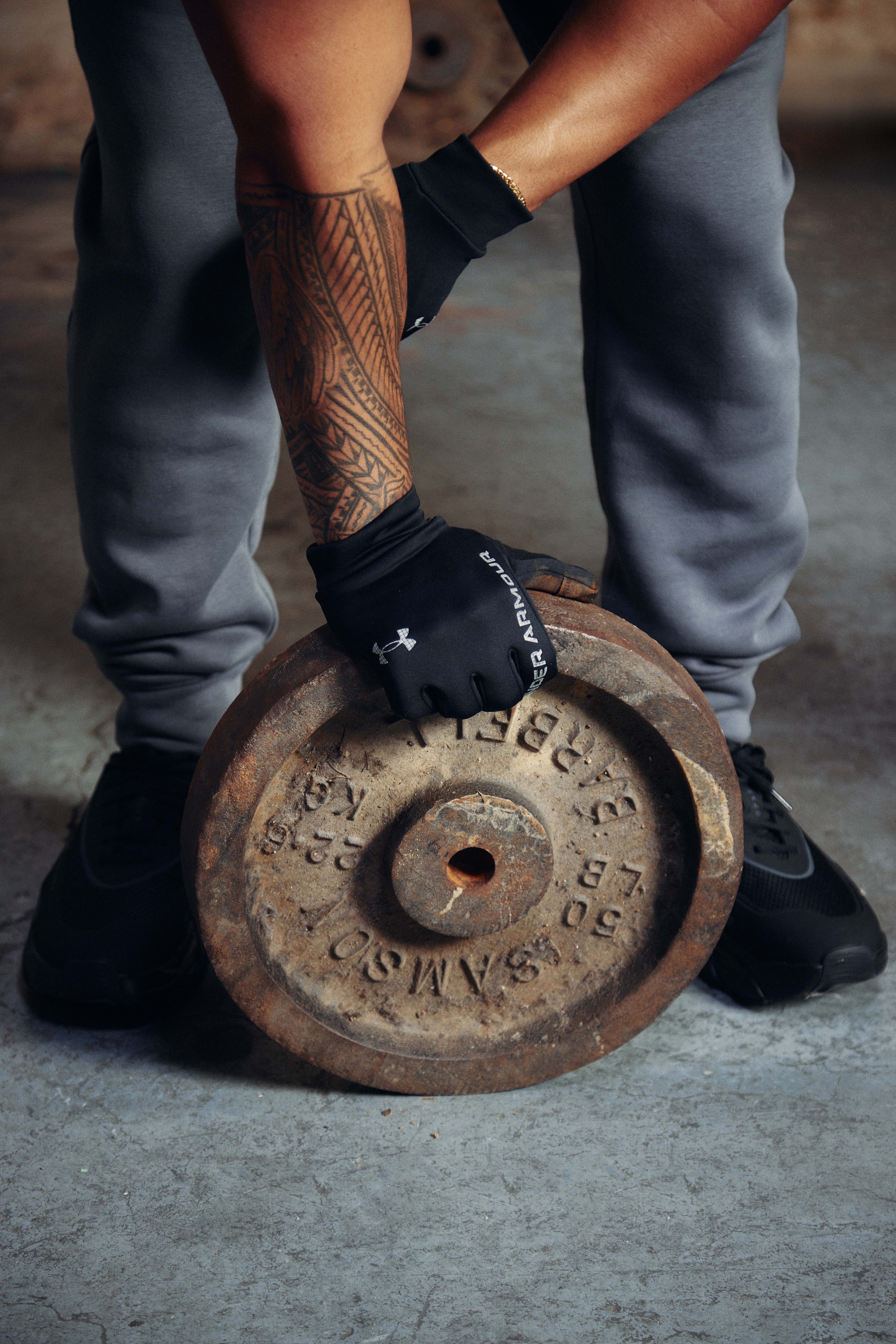 Hand with glove holding weight