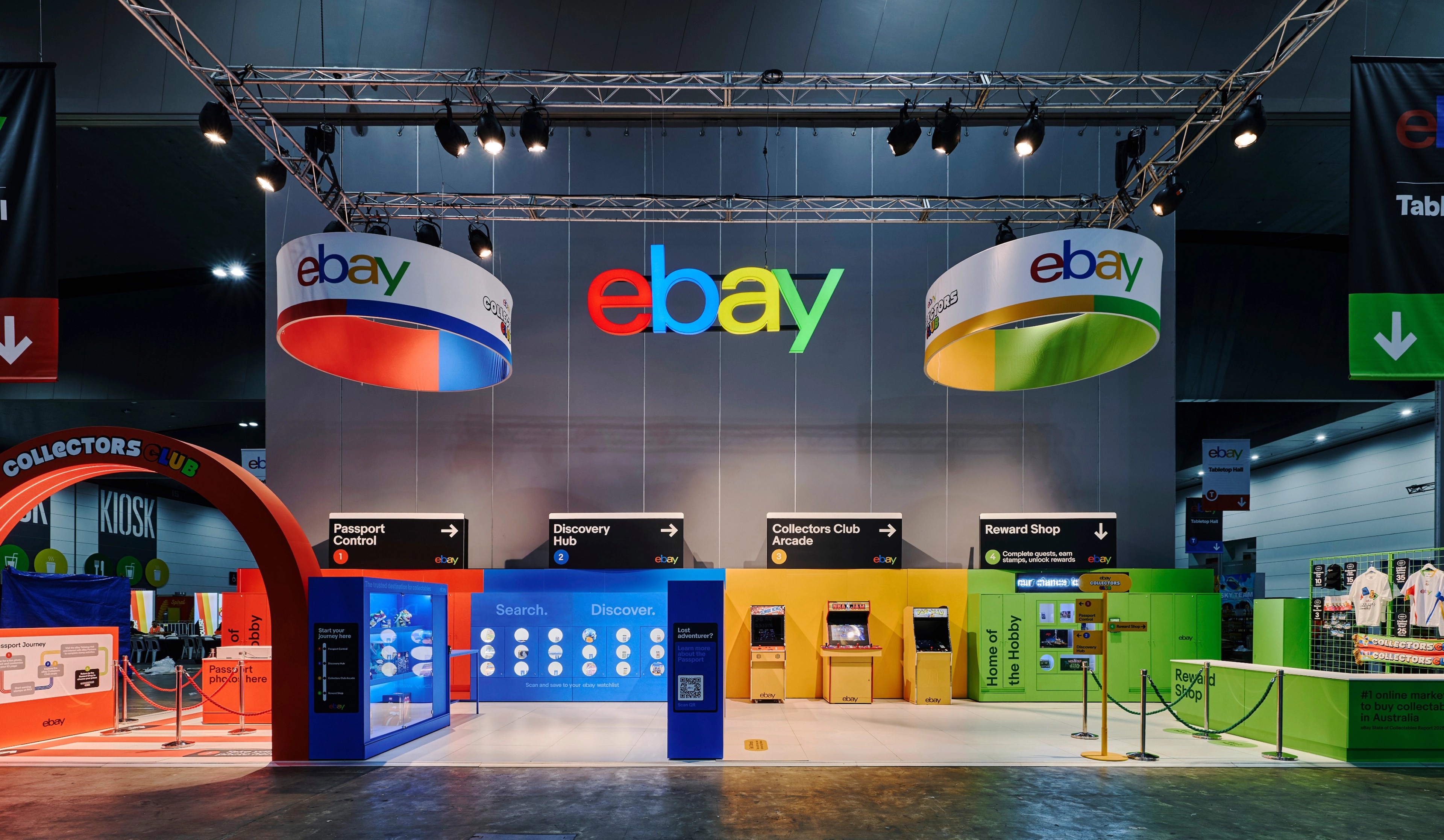 eBay Collectors Club exhibition booth at PAX Melbourne with colourful interactive stations and hanging branded signs