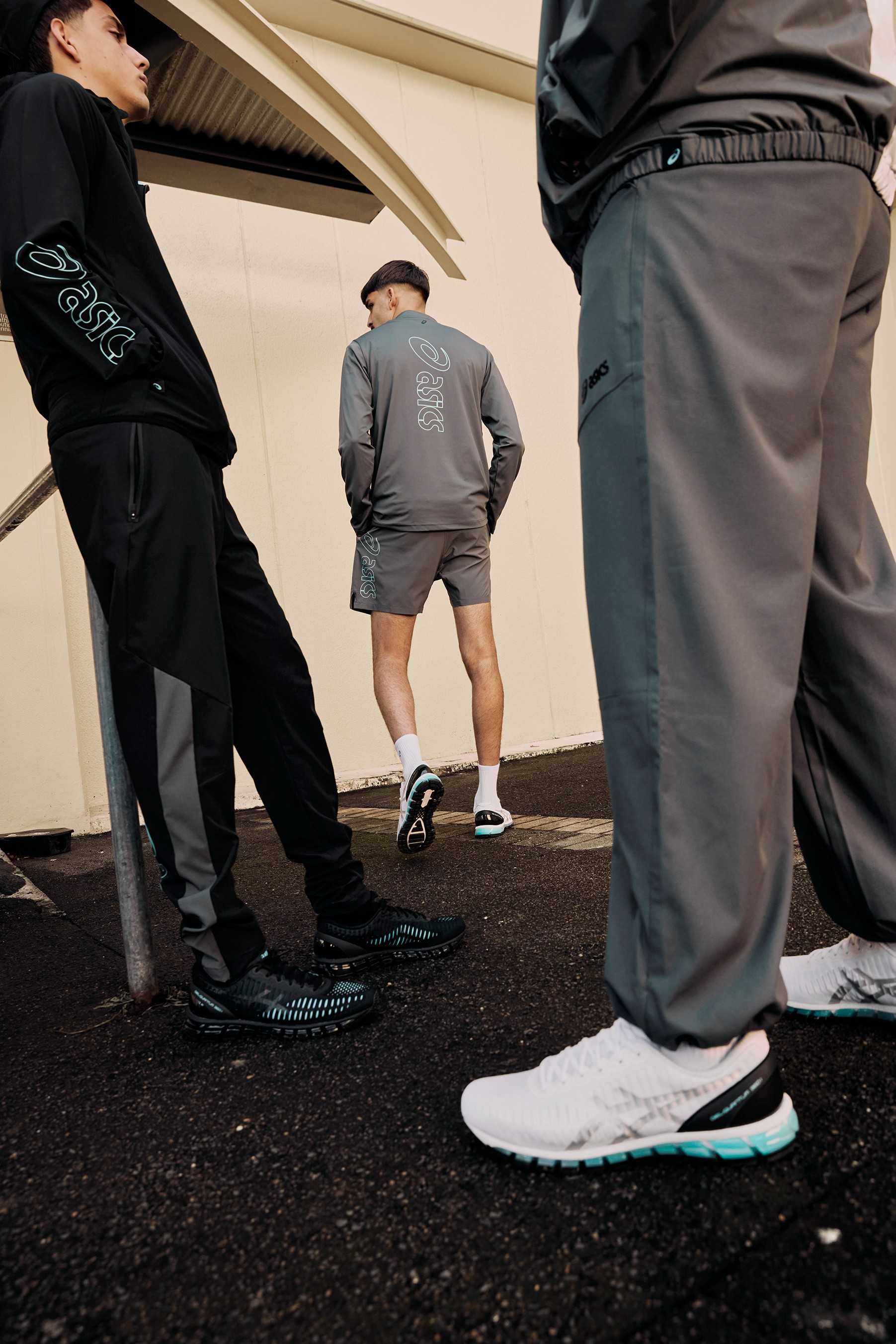 Street-level shot of legs and ASICS GEL-Quantum 360 shoes mid-stride