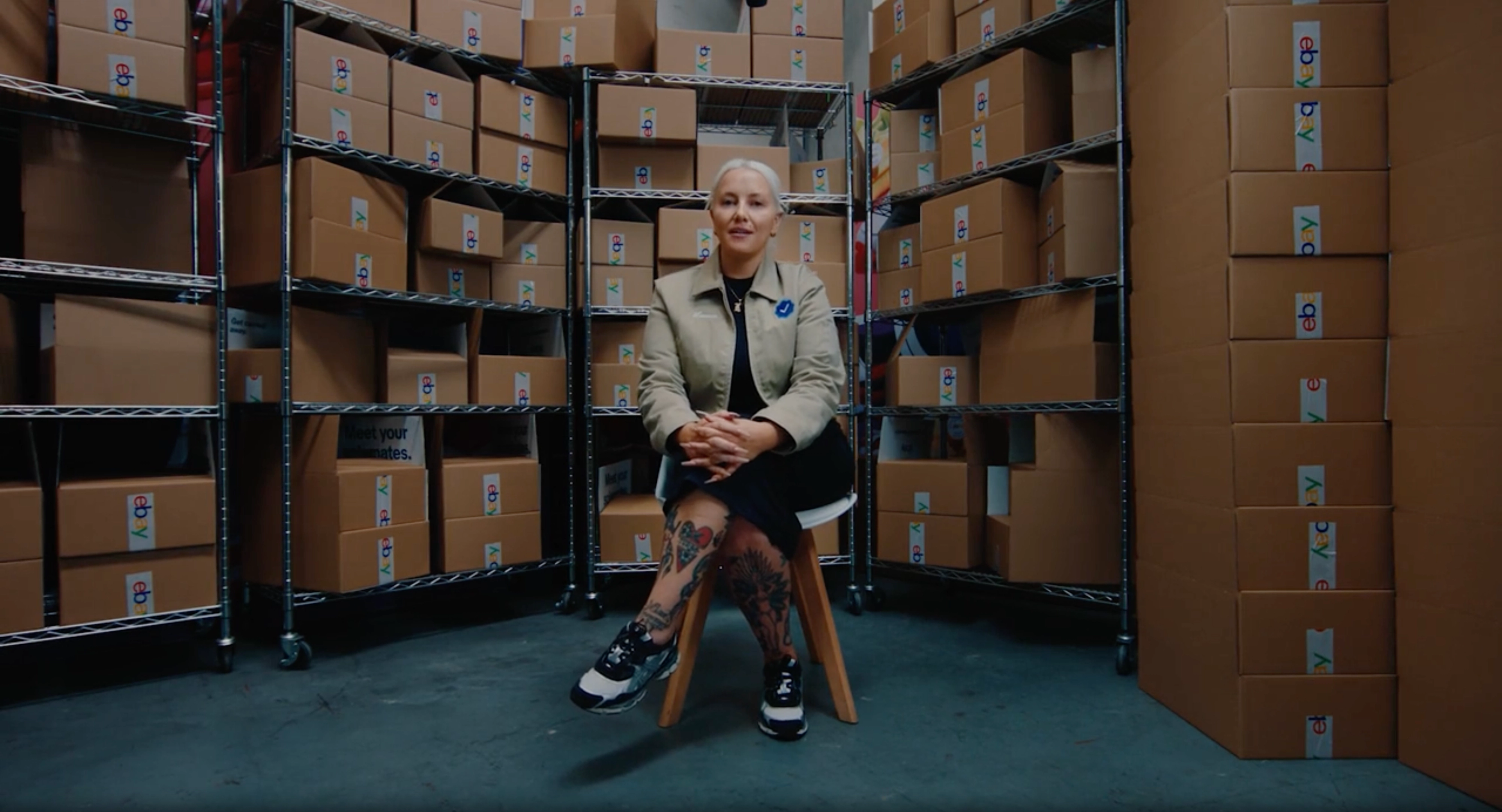 Woman sitting in chair in warehouse