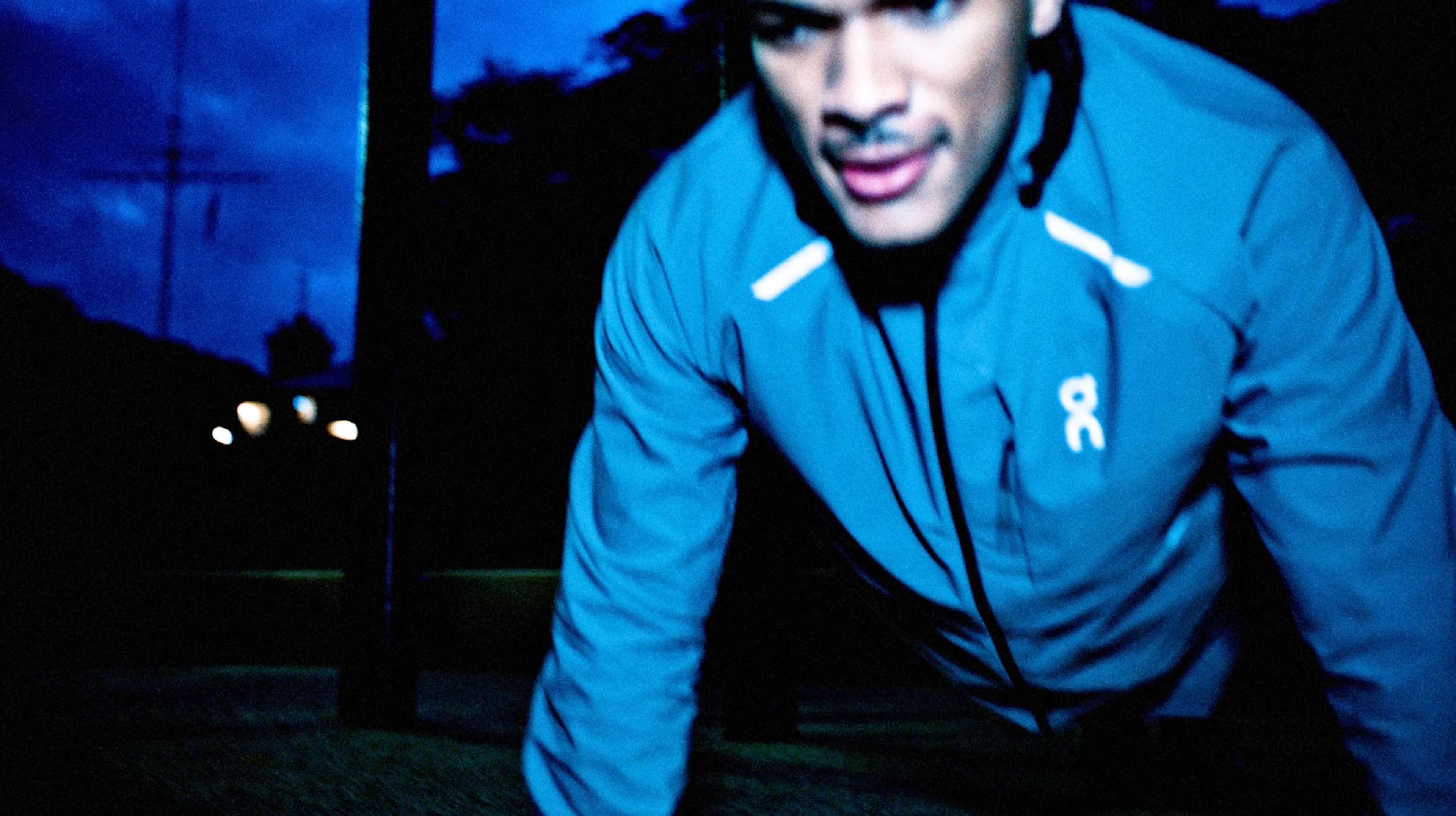 Close-up of the reflective Lumos Capsule jacket in electric blue